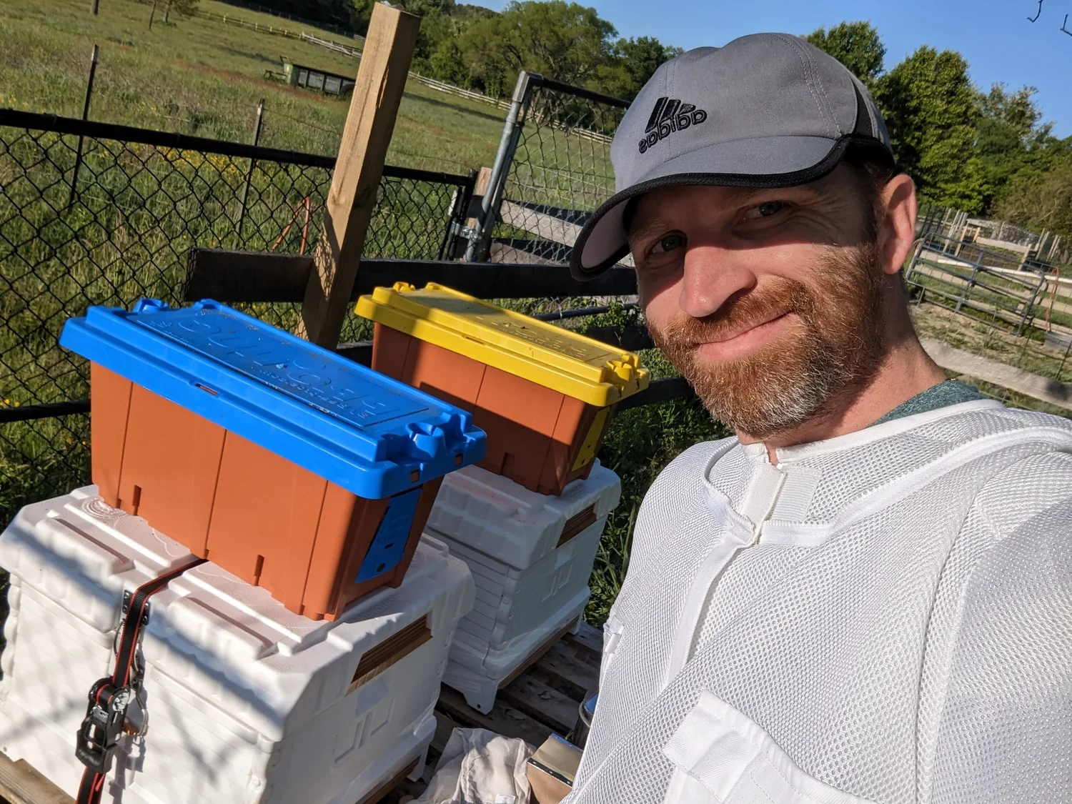 Aran Miller of Dragon Bee Farm with his Apimaye hives