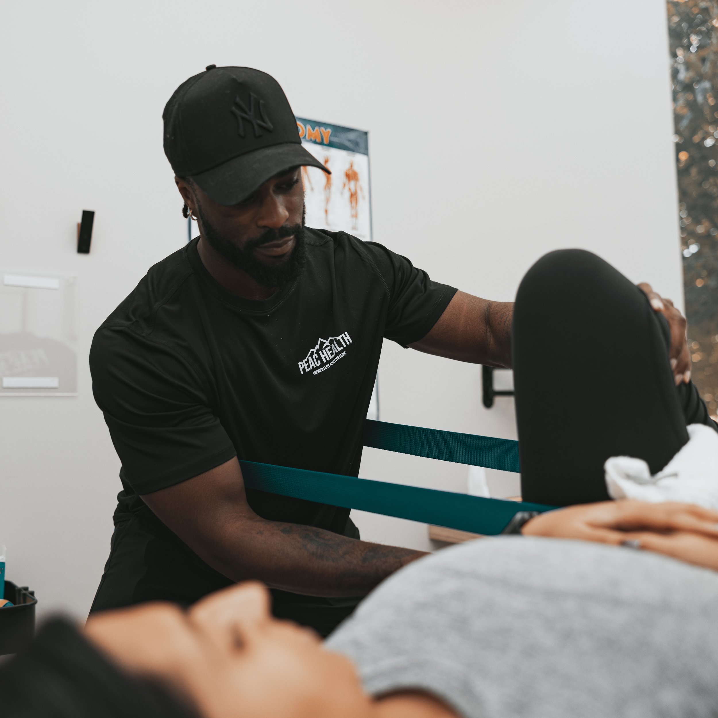Experienced physiotherapist providing hands-on manual therapy to relieve muscle tension