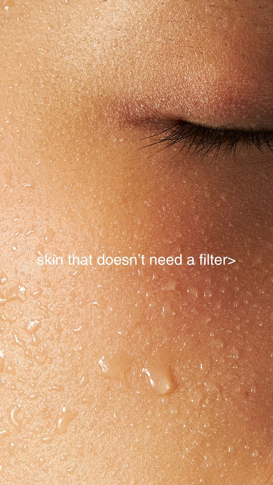 Close-up of a woman with glowing skin and text reading, “Skin that doesn’t need a filter.”