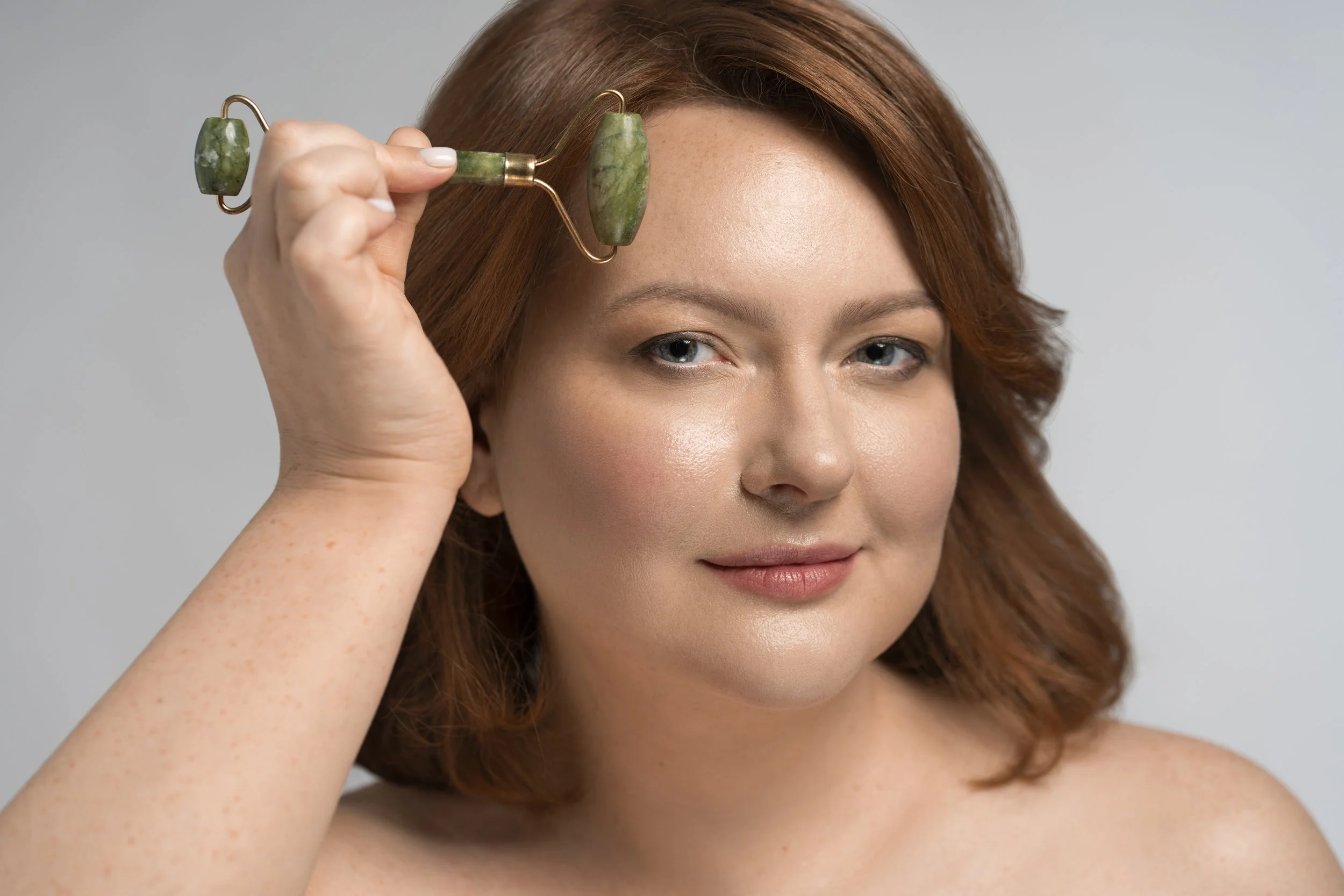 front-view-model-using-face-roller (1).jpg