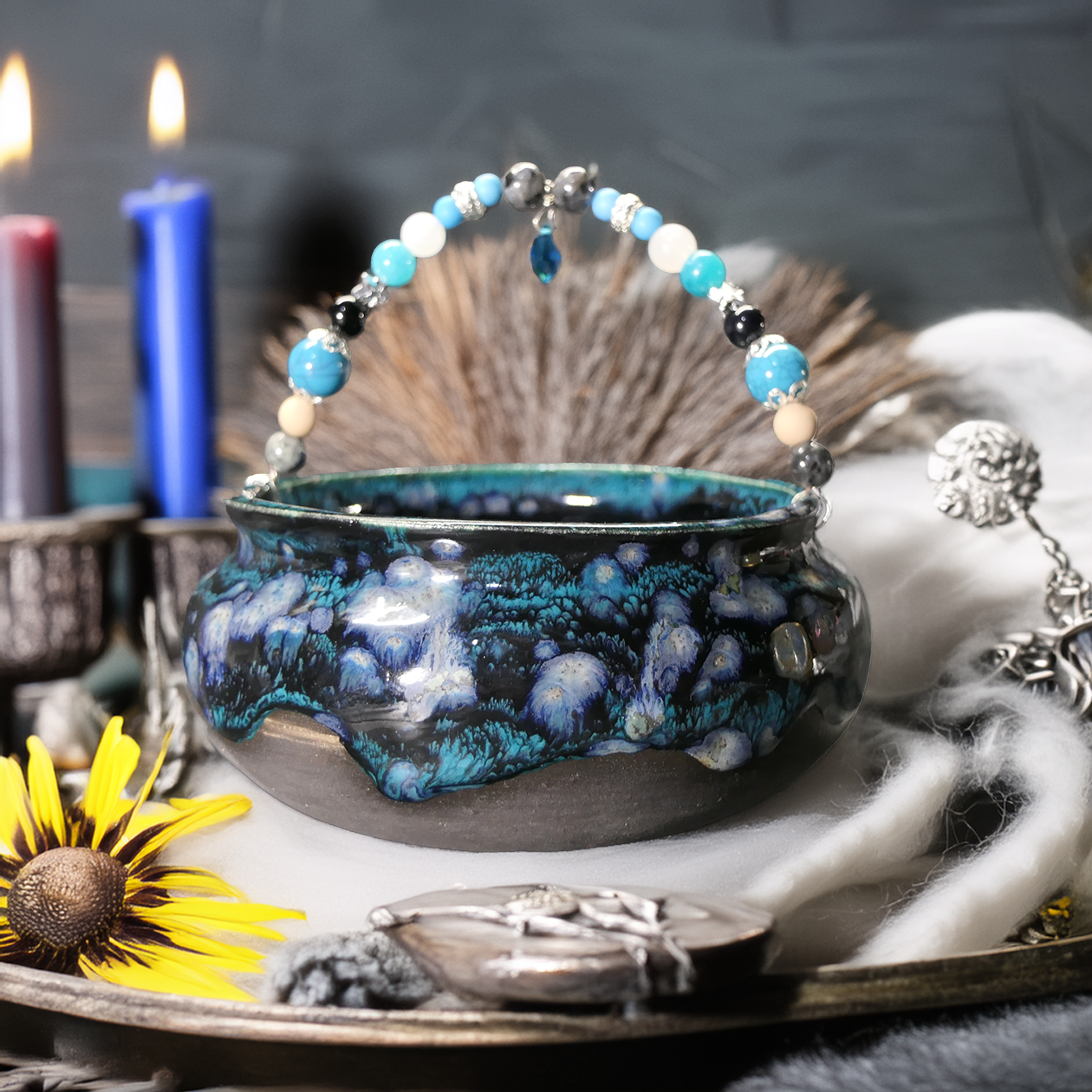 blk teal cauldron on alter.png