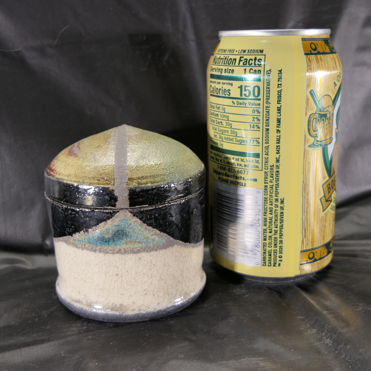 Raku jar with copper focal with can.png