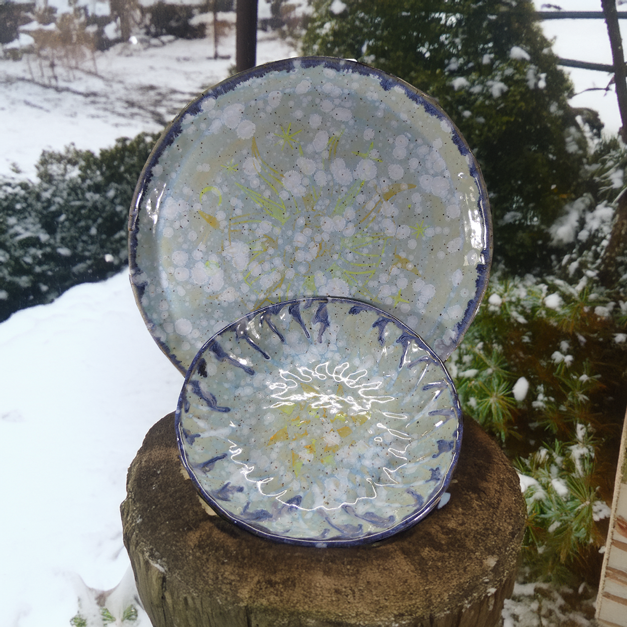 snowy sun plate and bowl outside.png