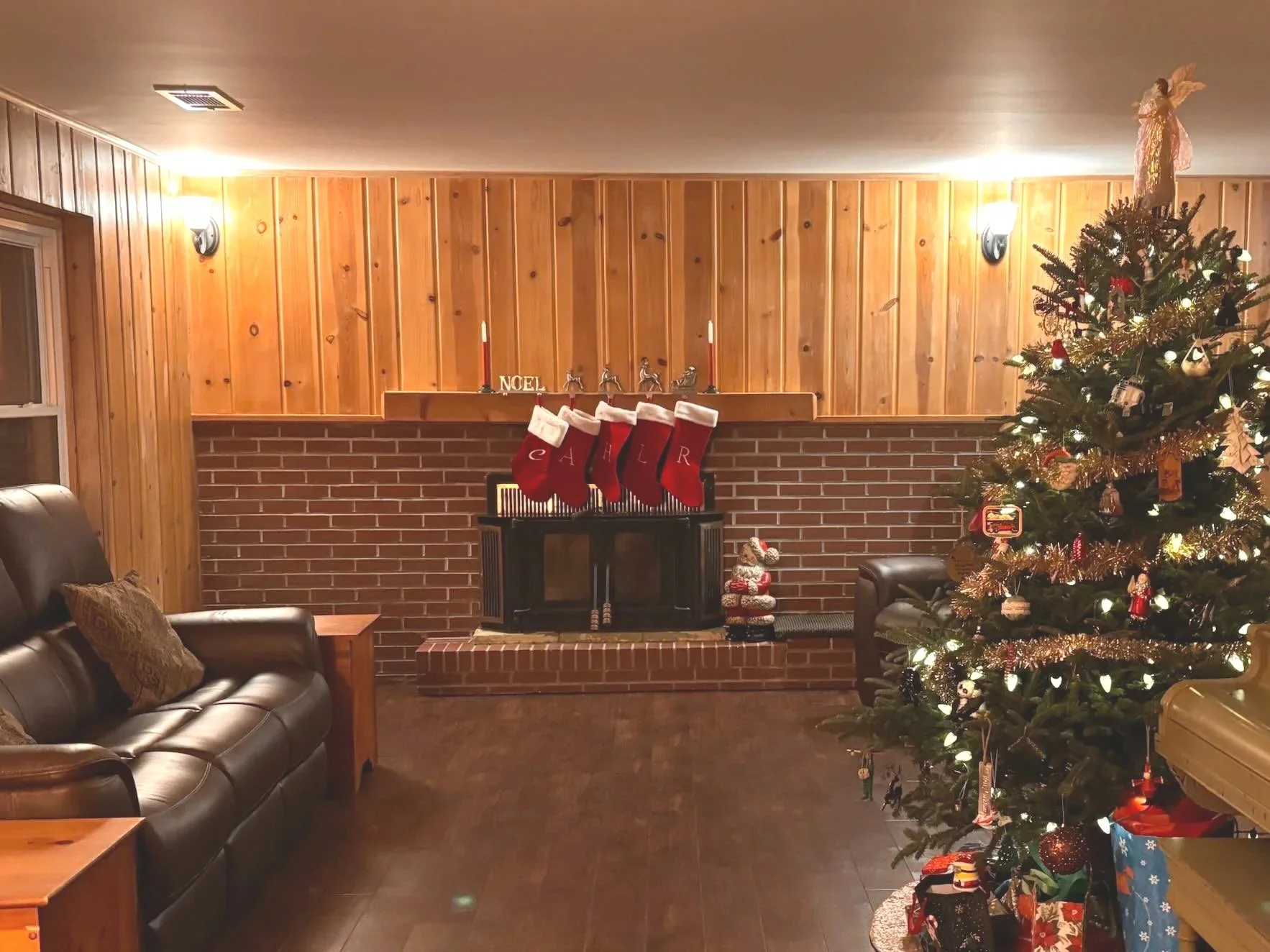Family Room remodel with fireplace wood panels and laminate flooring