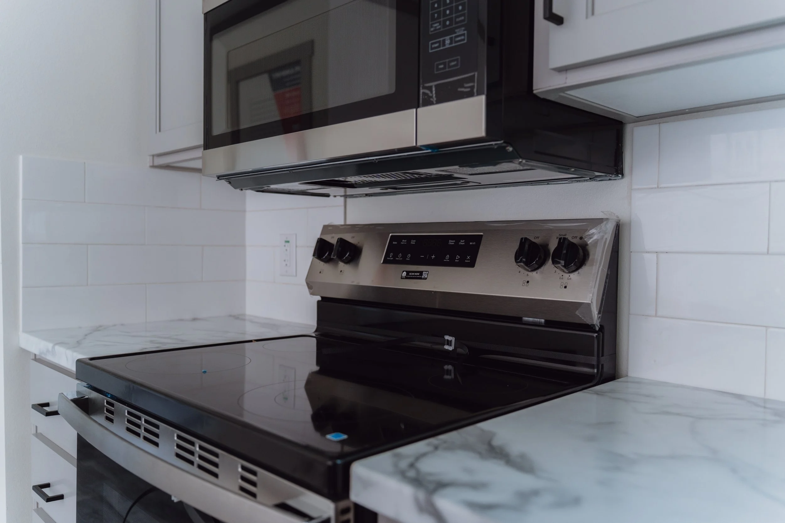 Stainless steel kitchen appliances in a manufactured home at Homestead San Antonio in San Antonio, TX