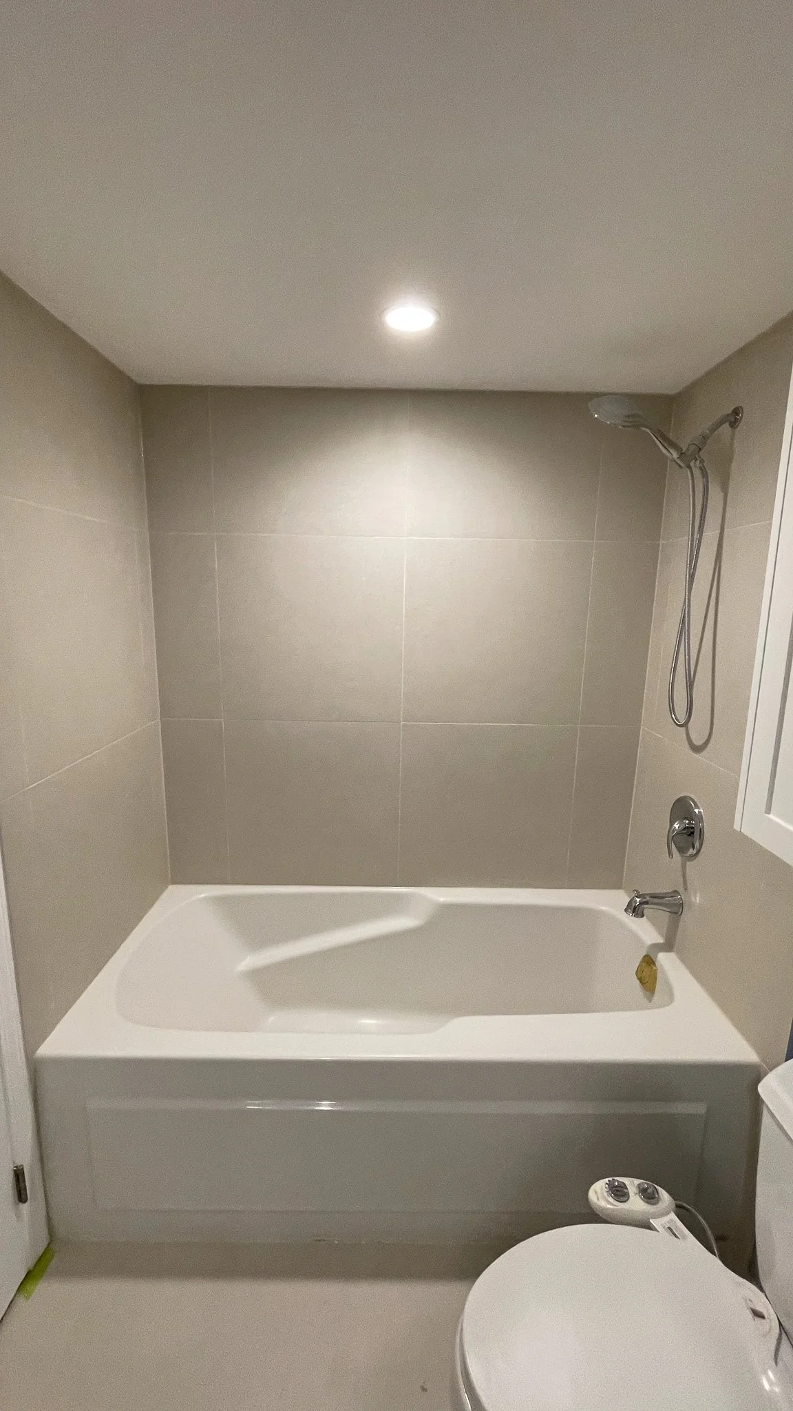 new tub in a newly renovation bathroom and fresh tiles