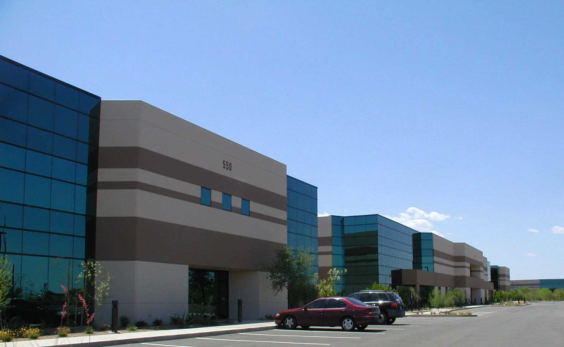 Modern flex office / industrial building with glass façade and landscaping at FRIP.
