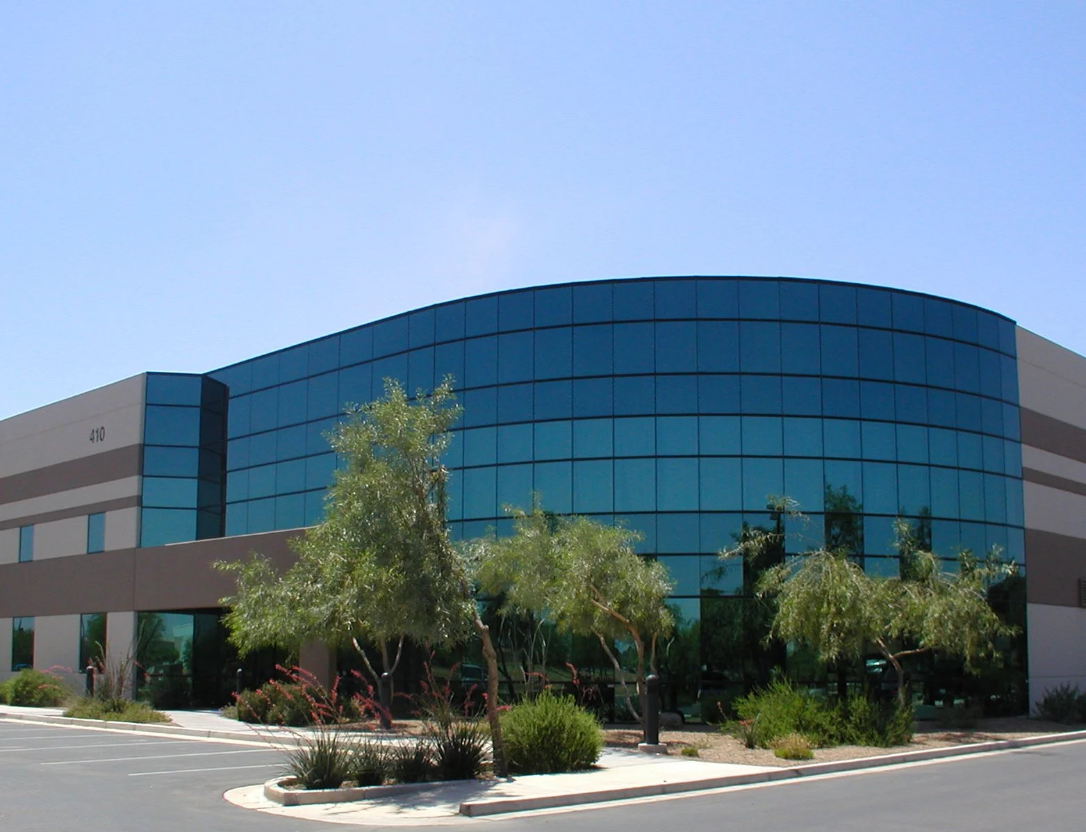 Modern flex office / industrial building with glass façade and landscaping at FRIP.
