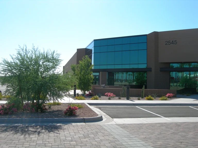 Modern flex office / industrial building with glass façade and landscaping at FRIP.