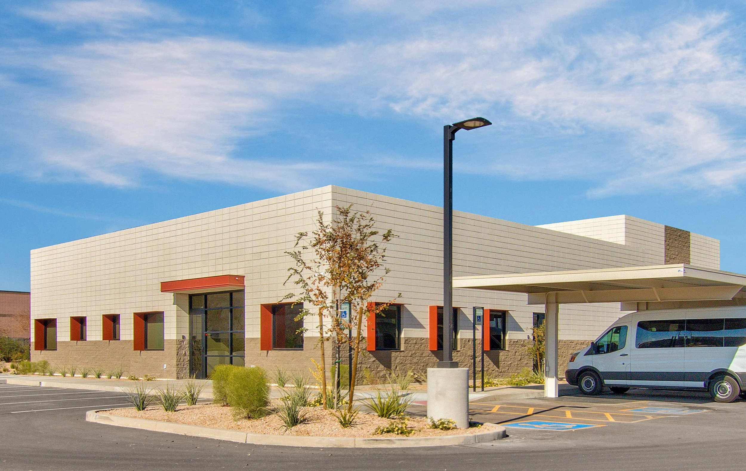 Single-story modern building with a parapet flat roof for Neely House adult daycare.