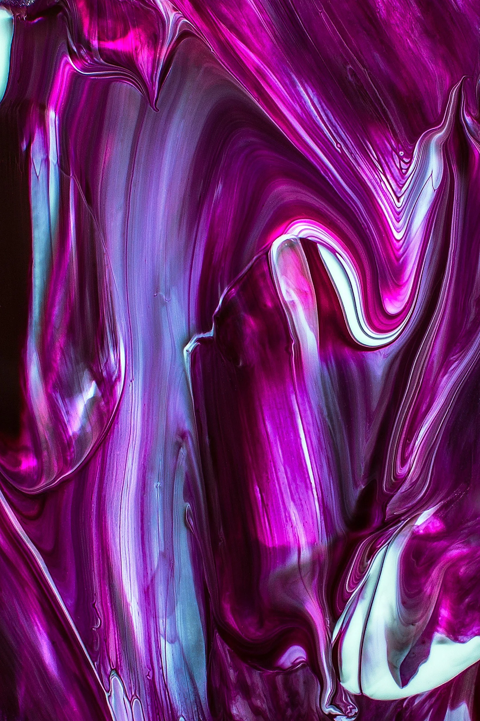 Abstract swirl of purple, pink, white, and hints of blue colors in a fluid, marbled pattern.