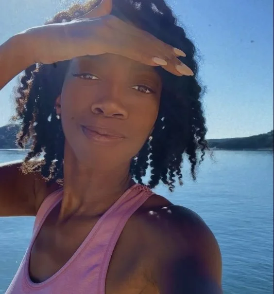 A beautiful shimmering Black woman on the lake. Jada Water. Astrologer and Philosopher