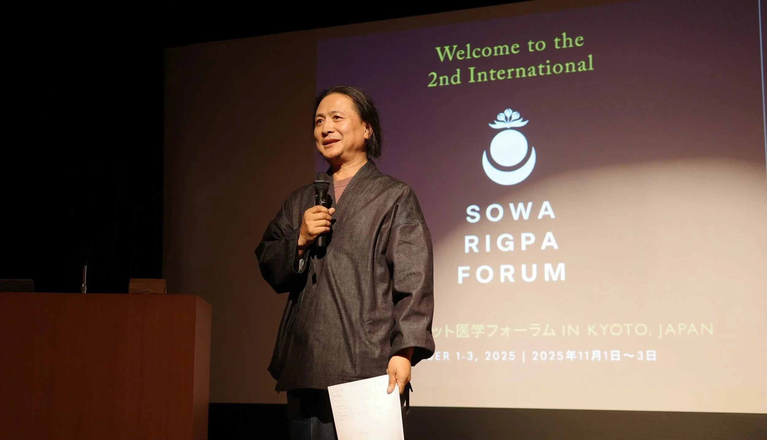 dr nida speaking at sowa rigpa kyoto forum