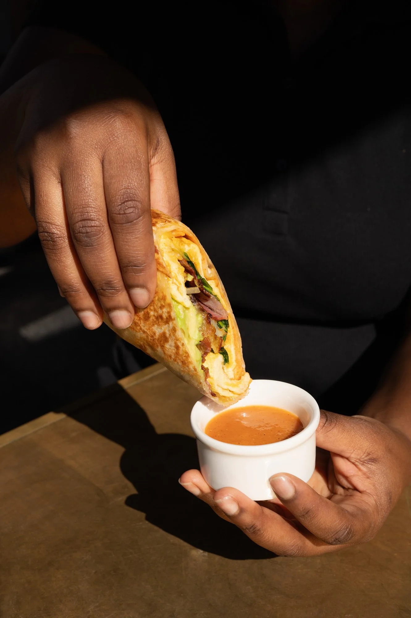 Photo of bacon & crispy potatoes breakfast burrito at zinqué, a French restaurant