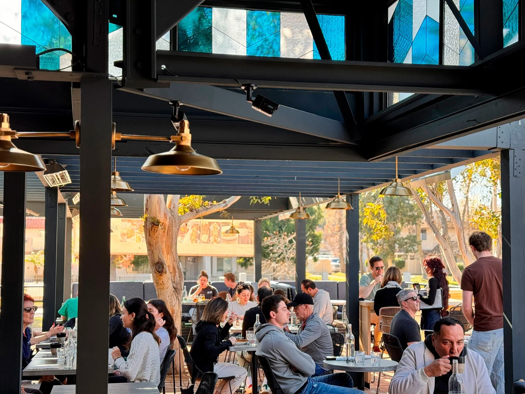 Photo of people dining on outdoor patio at zinqué, a French restaurant in Westlake Village