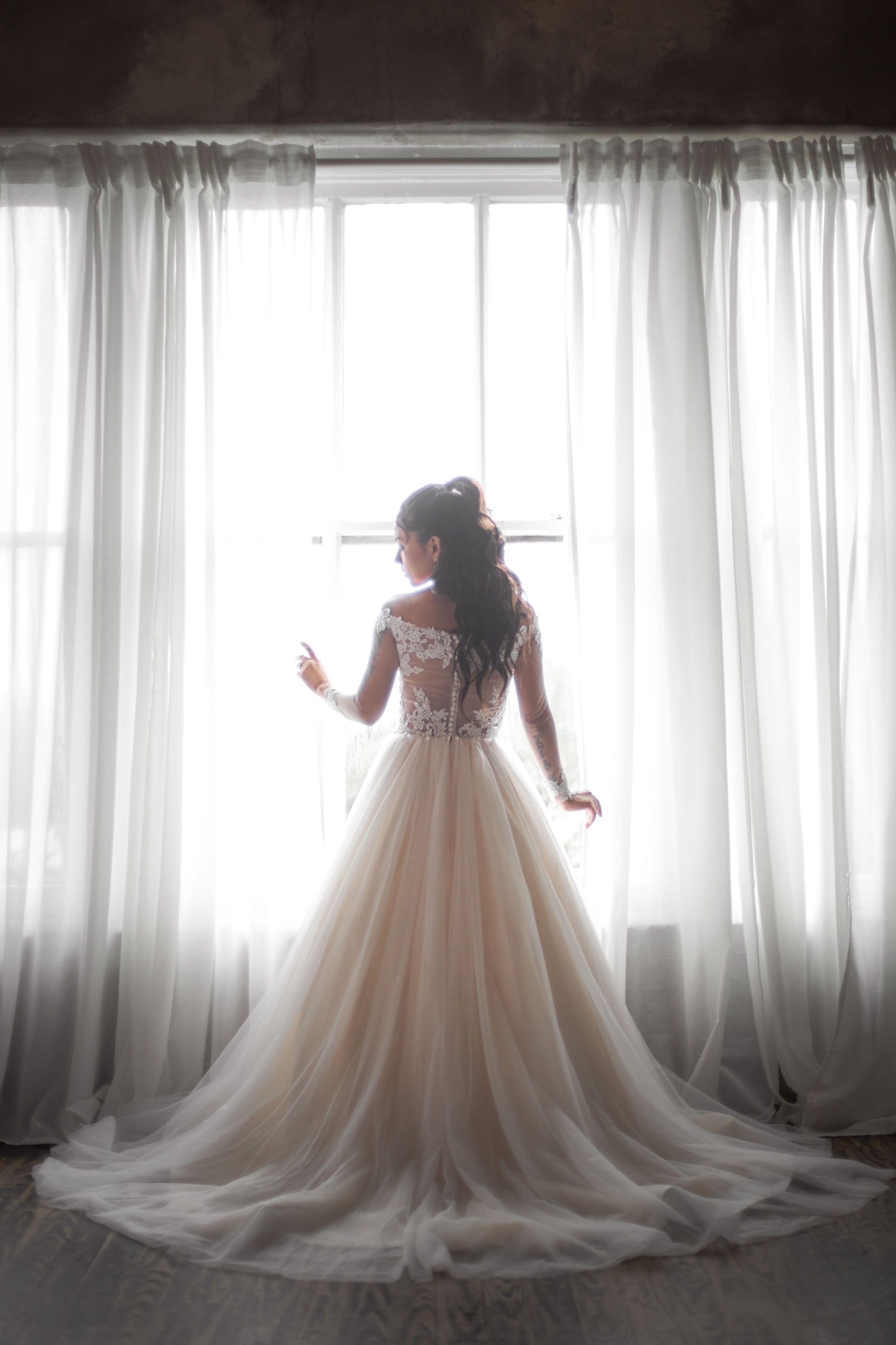 Cinematic wedding imagery showcasing candid emotion and modern wedding aesthetics.