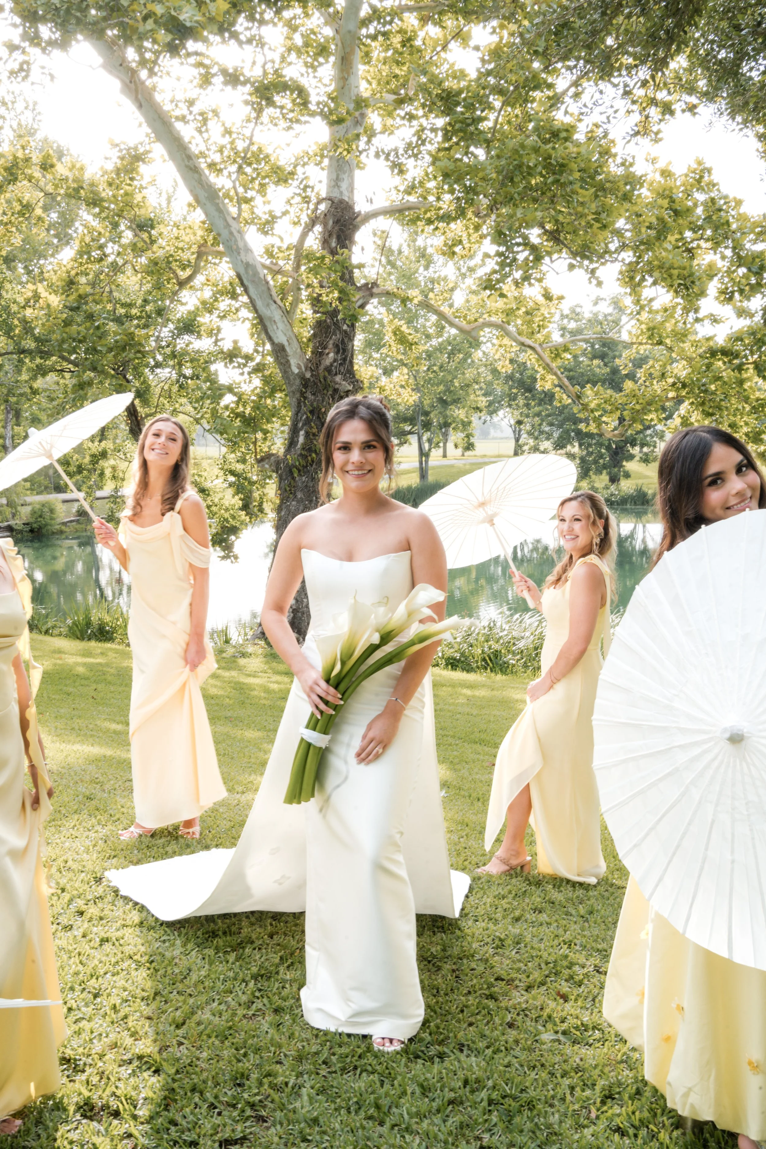 a bride is holding her flowers while bridesmaids surround her 