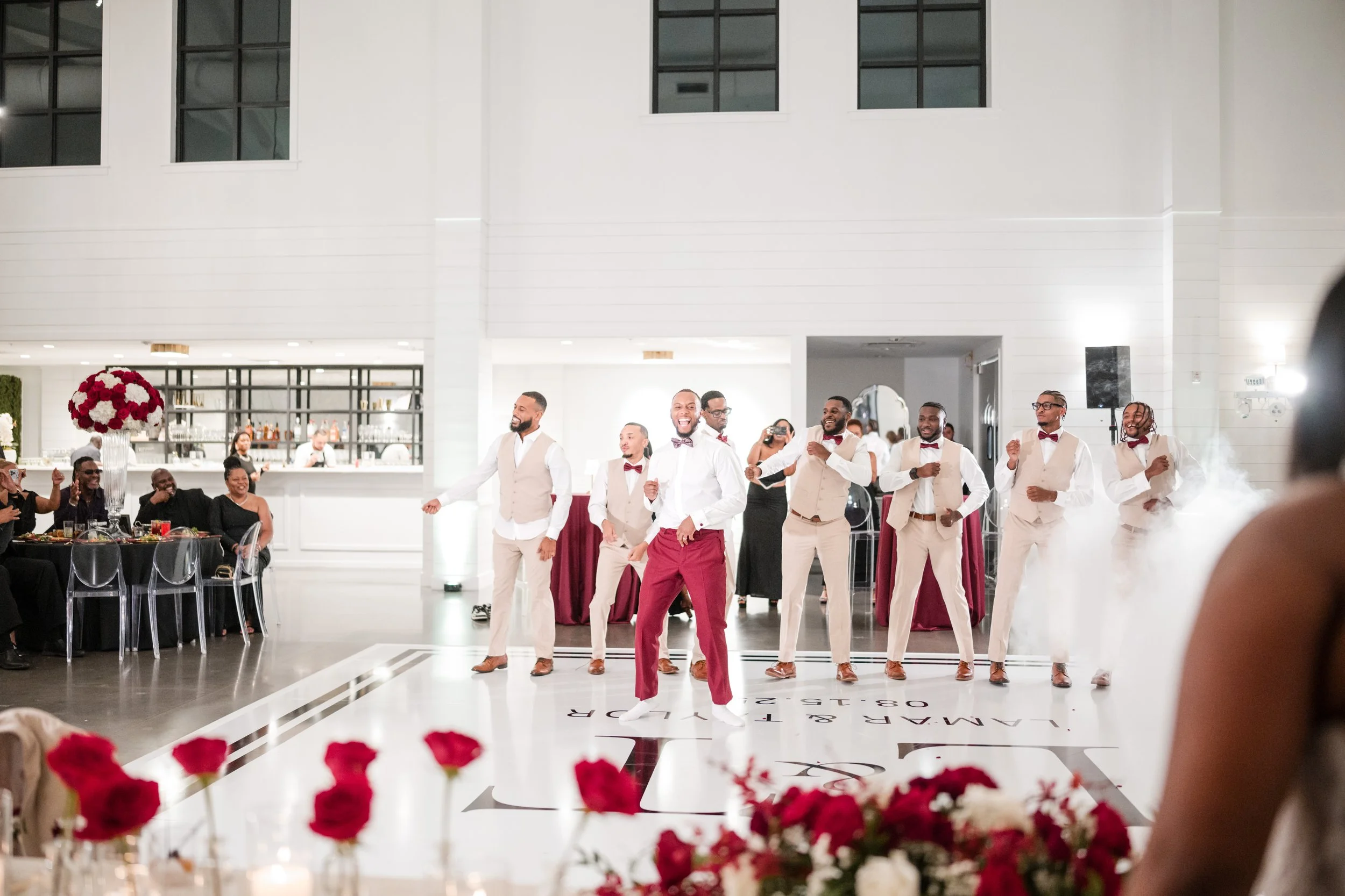 a groom is dancing with his groomsmen 