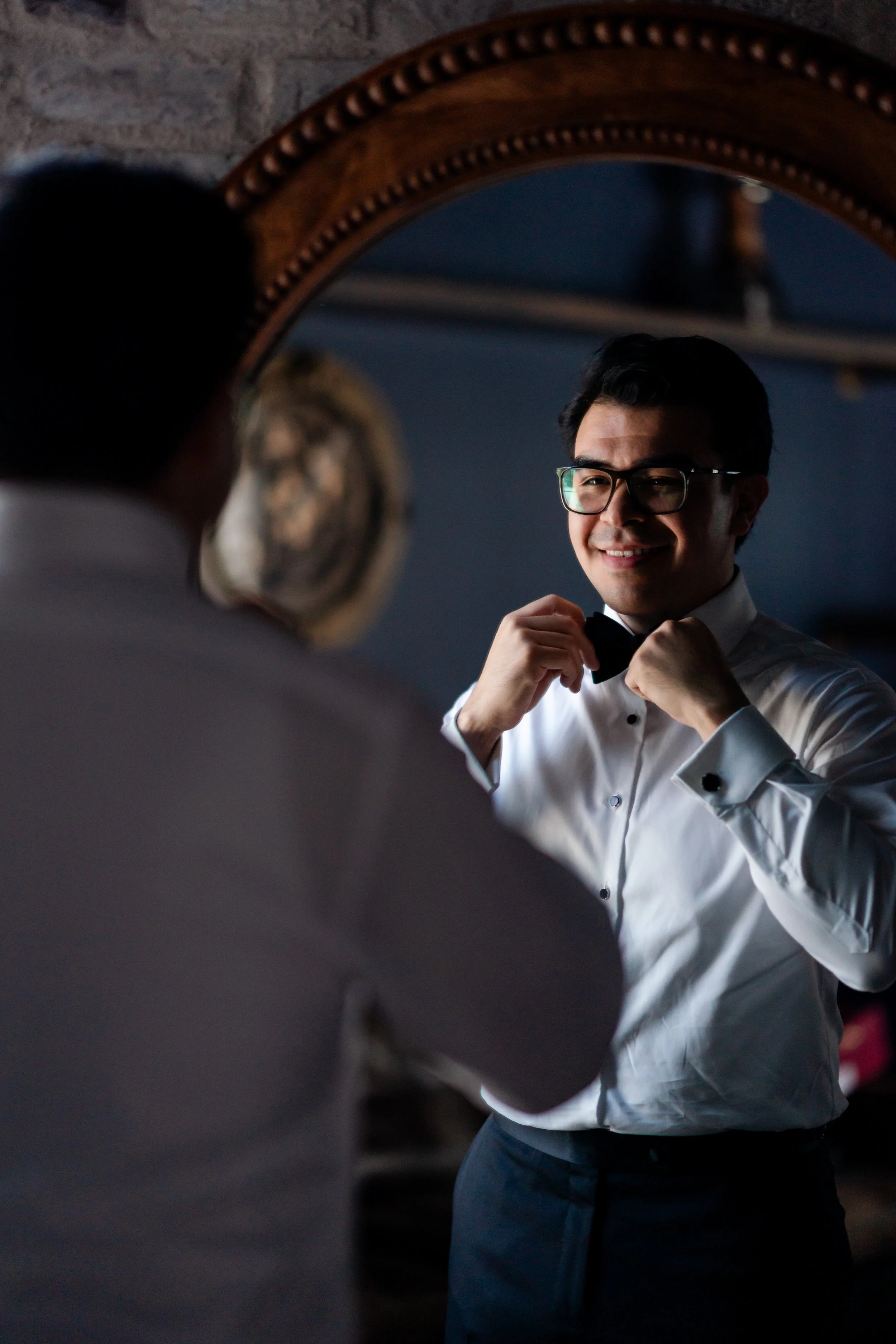 a groom is getting ready for the alter 