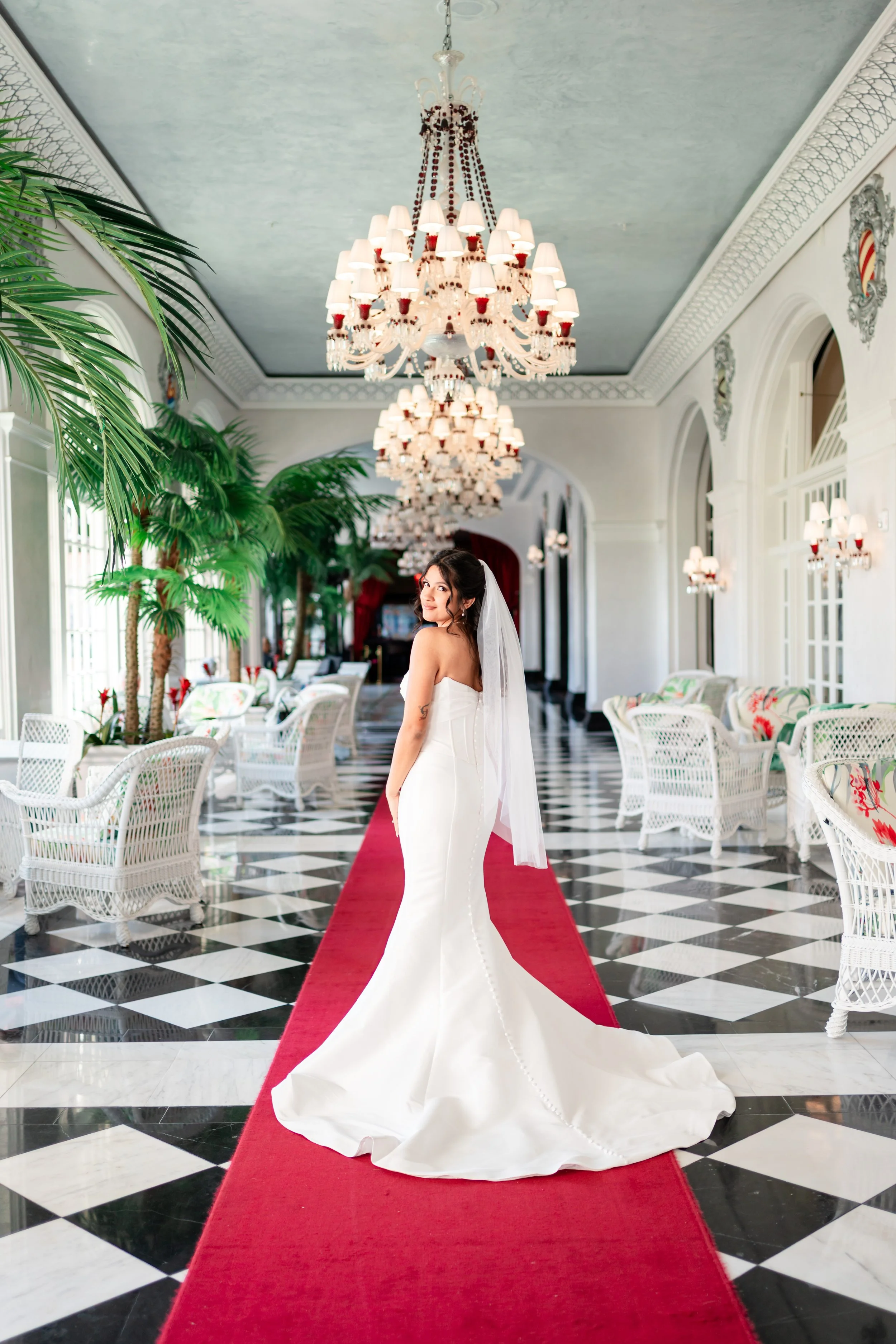 a bride taking her bridal portraits at the grand galvez in galveston