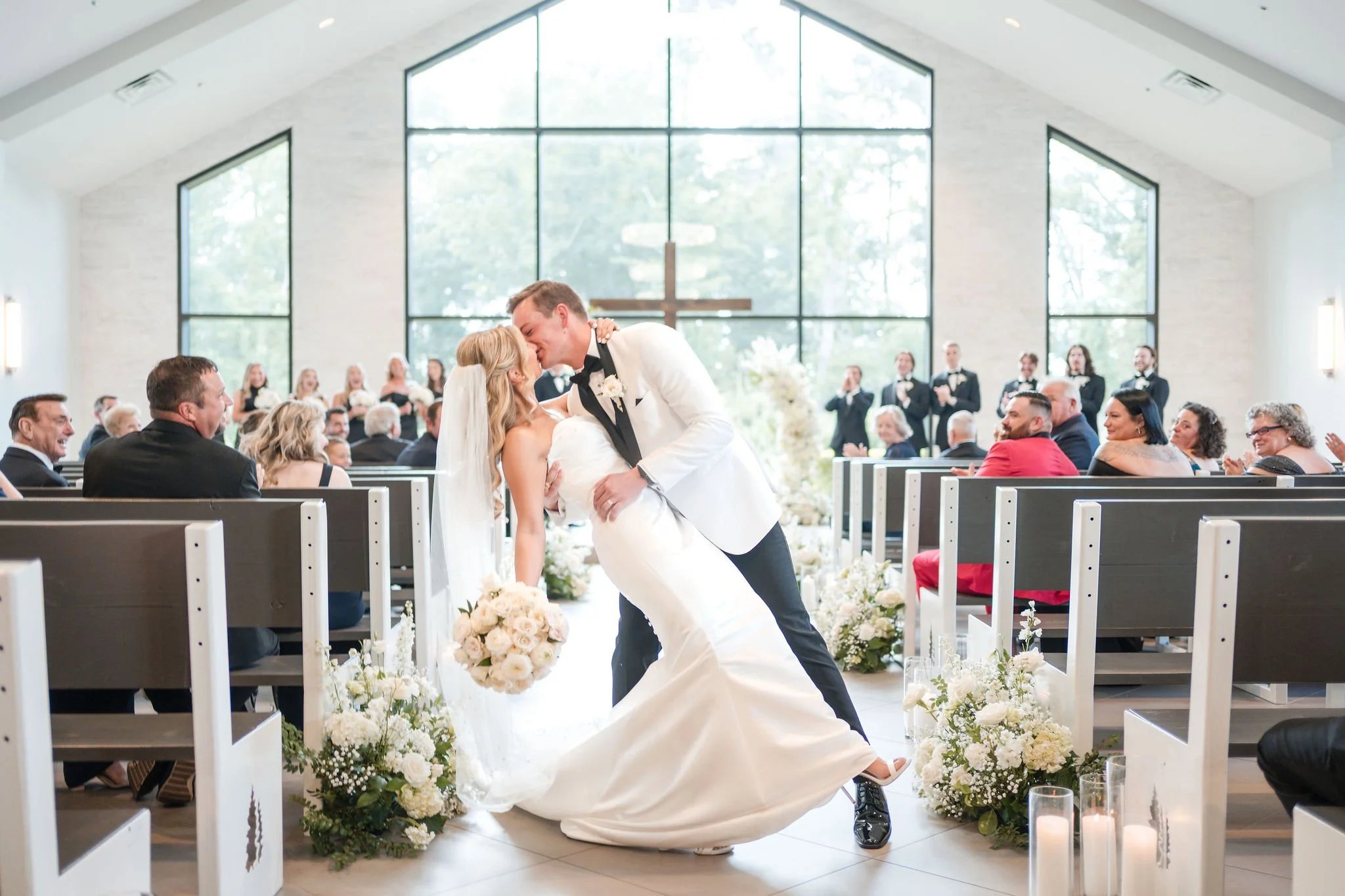 Emotional wedding photography capturing unscripted, candid moments in a modern wedding setting.