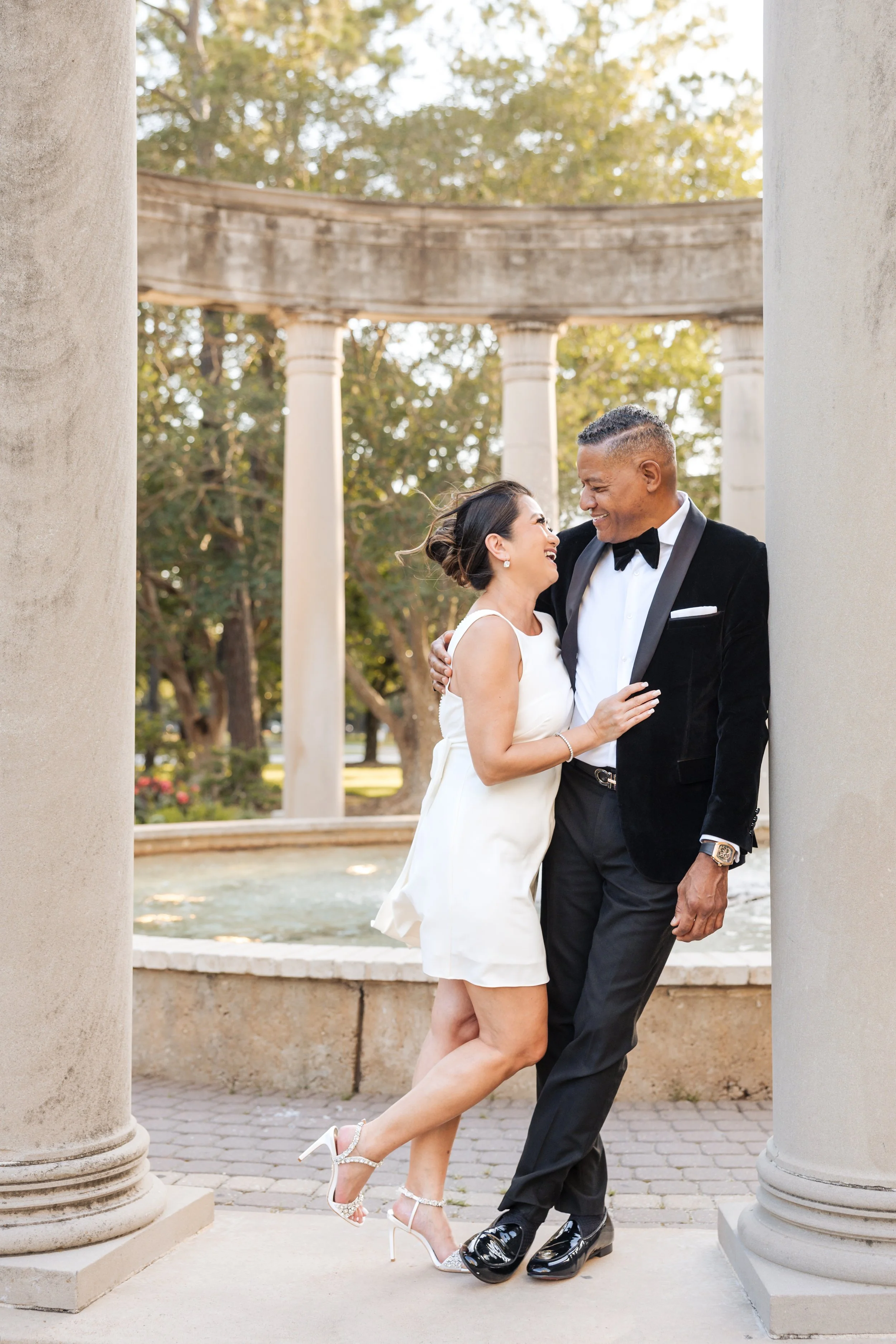 an older couple is taking engagement pictures together