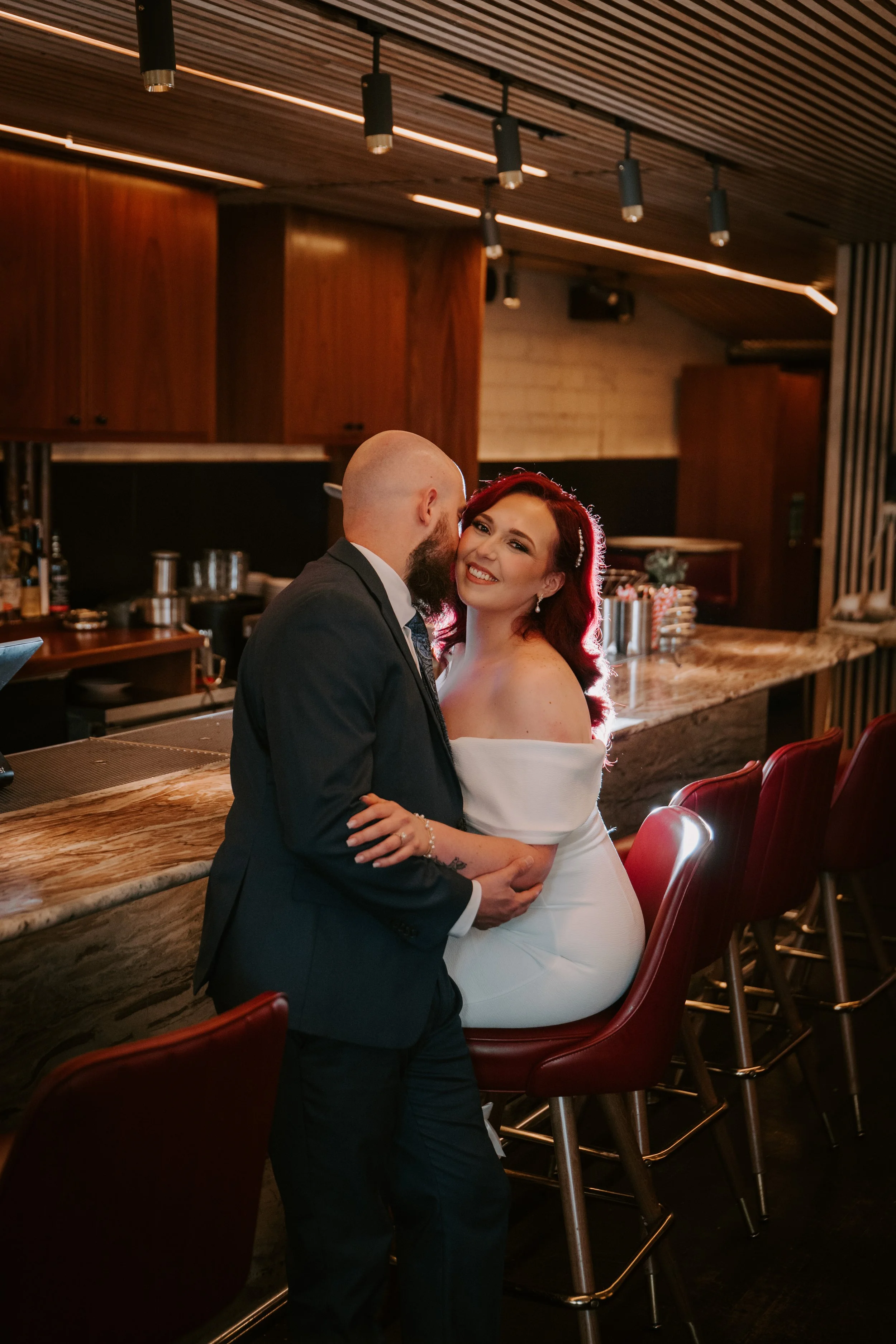 a couple is taking their engagement pictures in a restaurant in houston