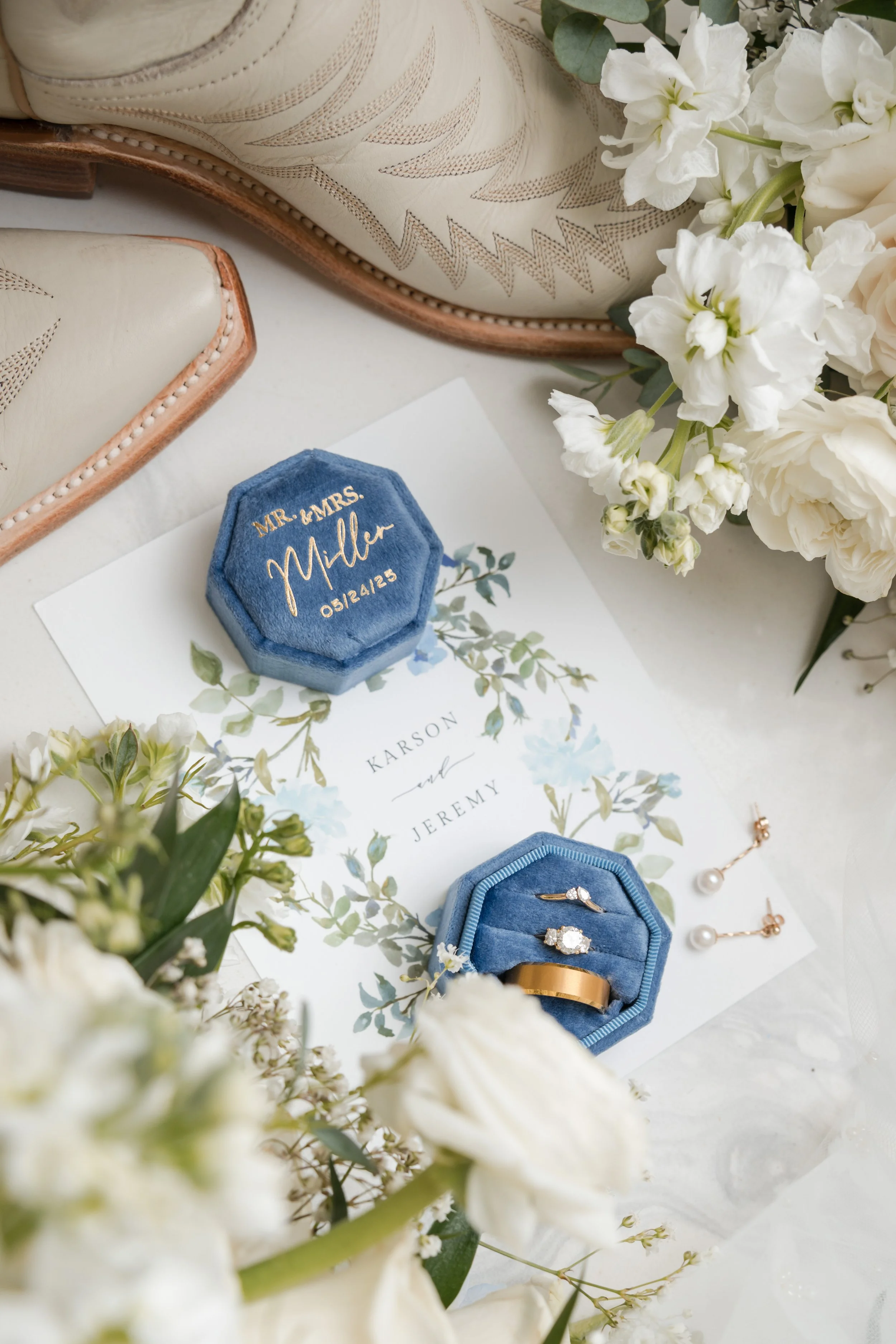 a flatlay of wedding items for the couples wedding day