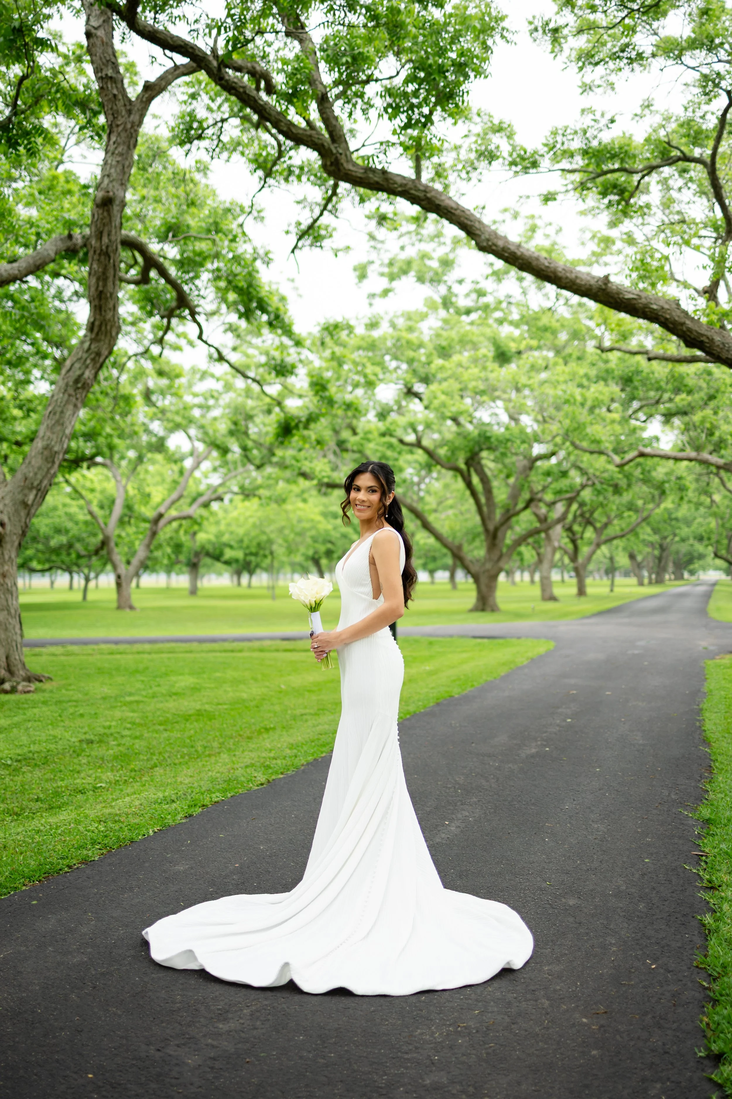 a bride in houston is holding her flowers