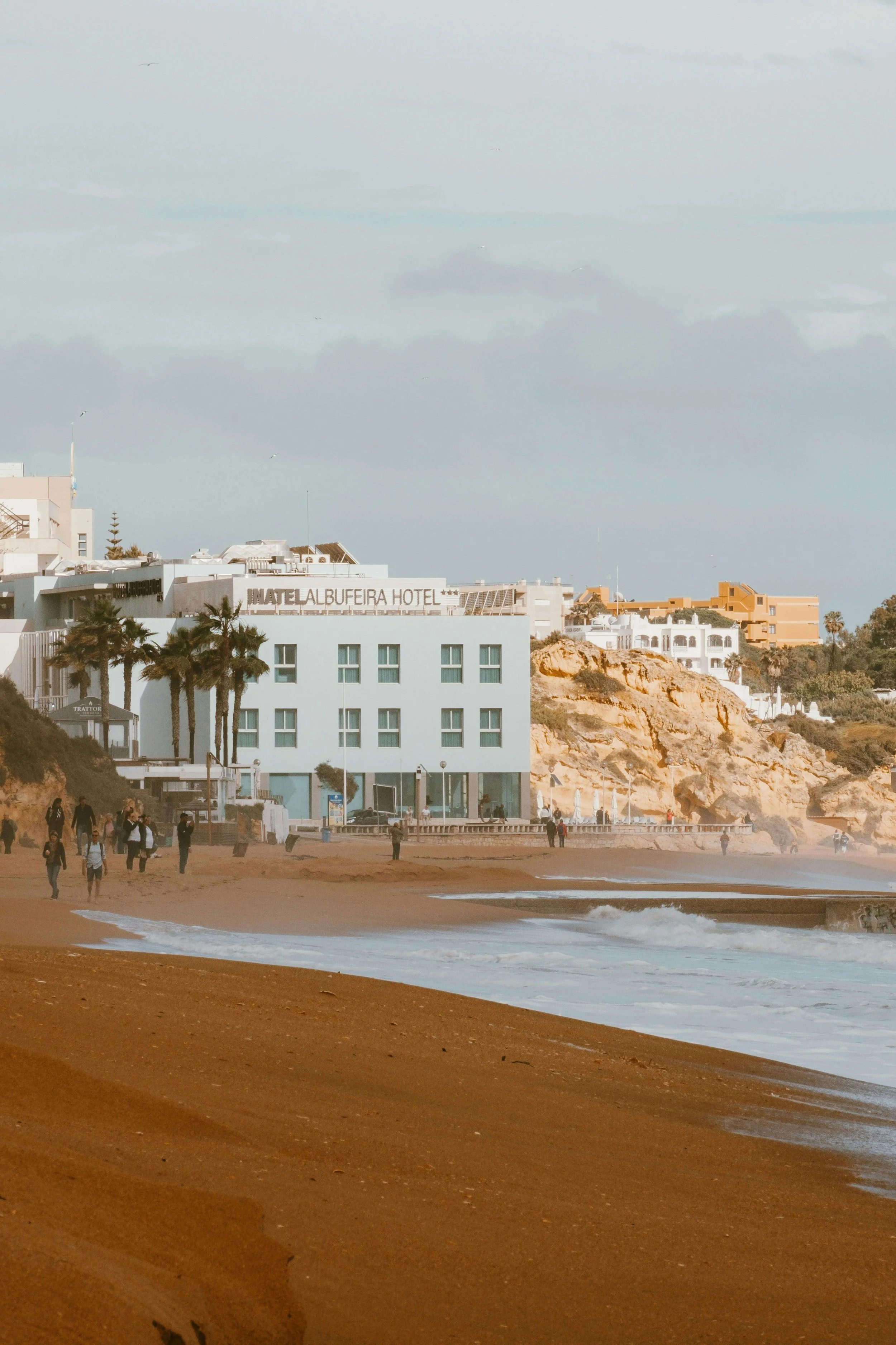 View of Albufeira coastline where mobile physiotherapy services are available.