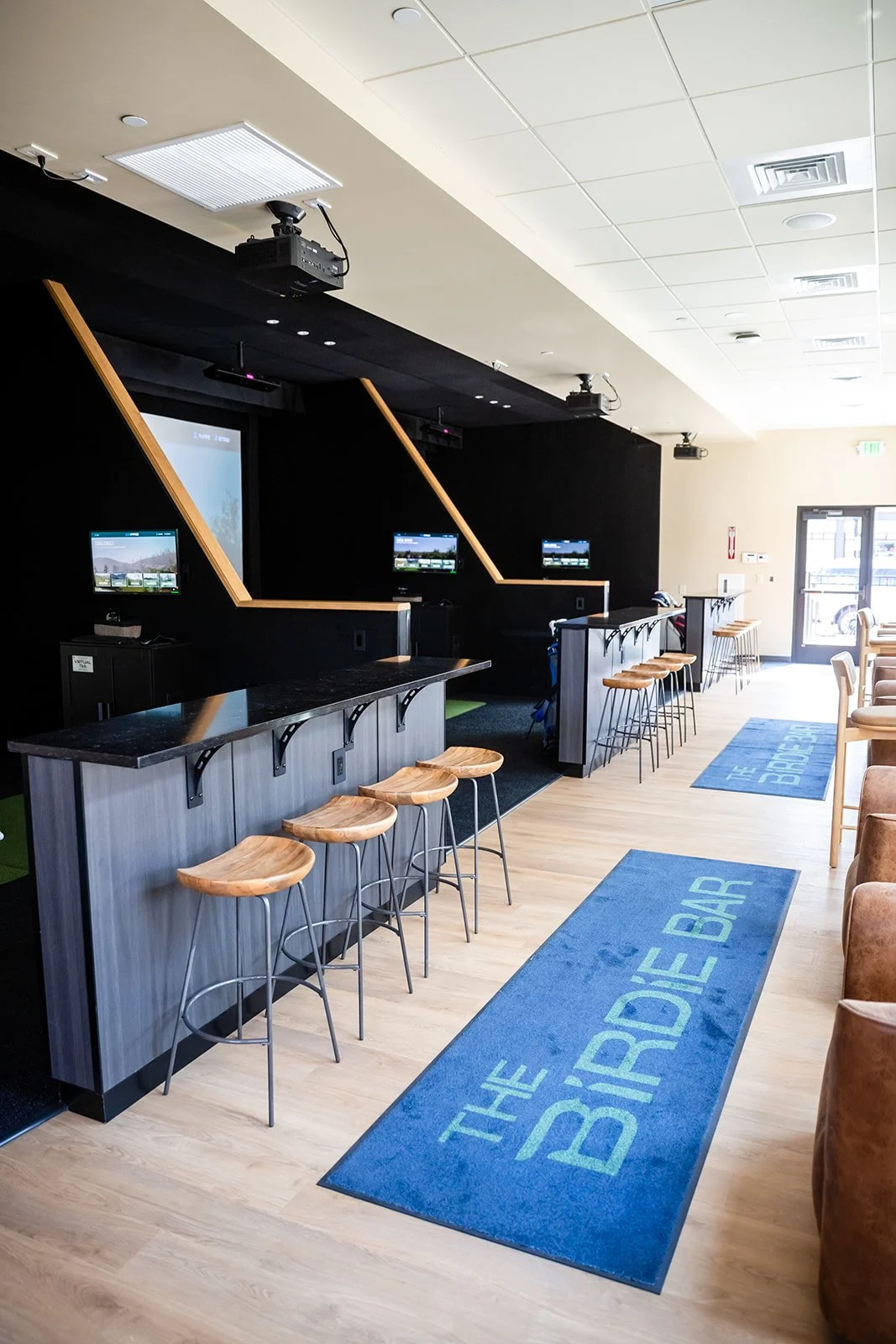 Close-up of vintage golf clubs, including MacGregor Medalist irons, in a golf bag.