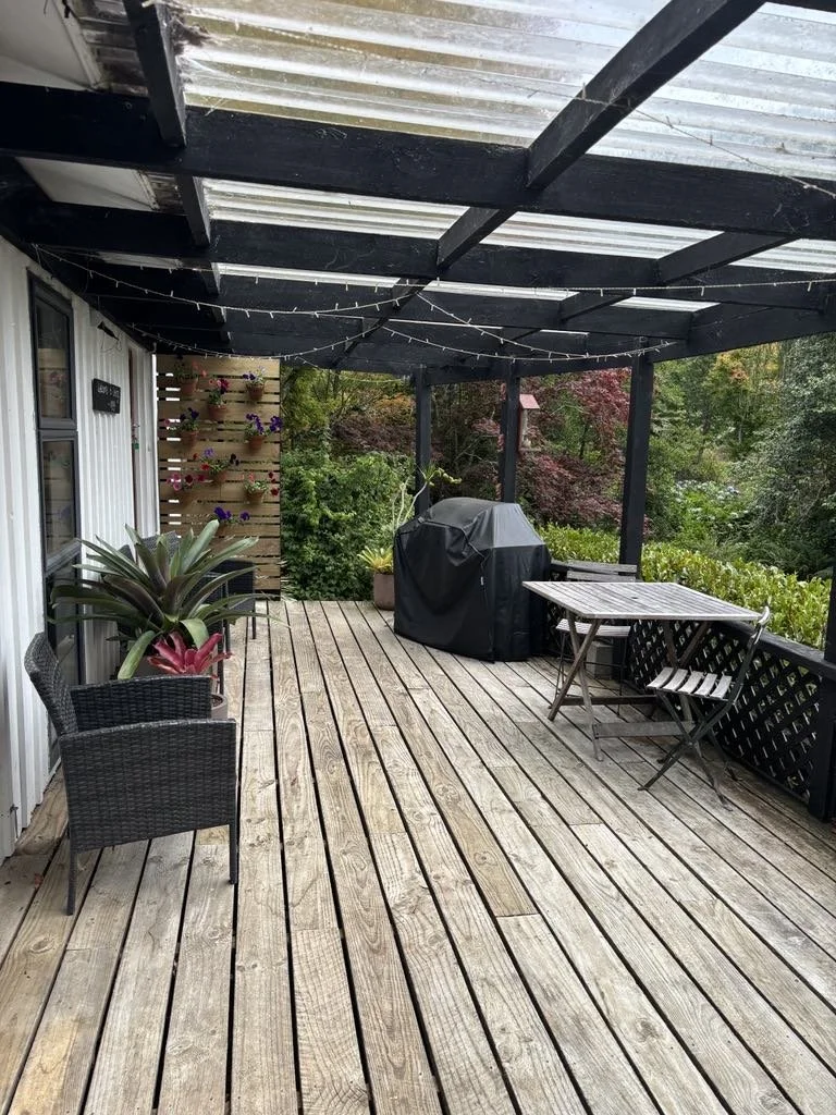 Private deck accompanied with BBQ and outdoor furniture.