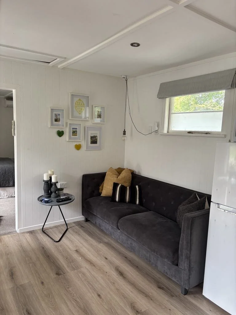 The cottage has a comfortable sofa to watch TV or read a book.