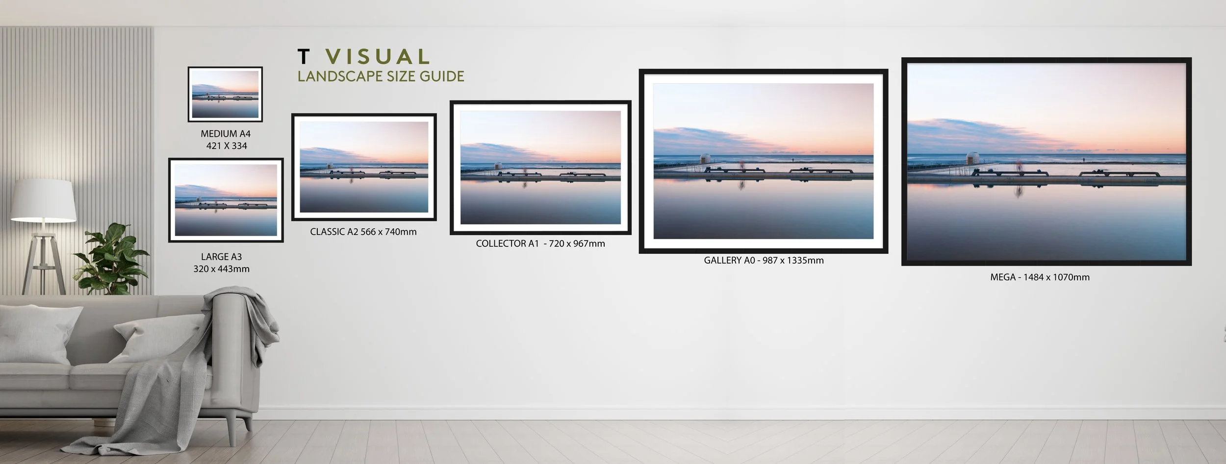 A wall displaying a landscape size guide for various art print formats, with images of a sunset over water in different sizes from medium A4 to mega. There is a sofa with pillows and a blanket in the foreground, a floor lamp, and a potted plant to the left.