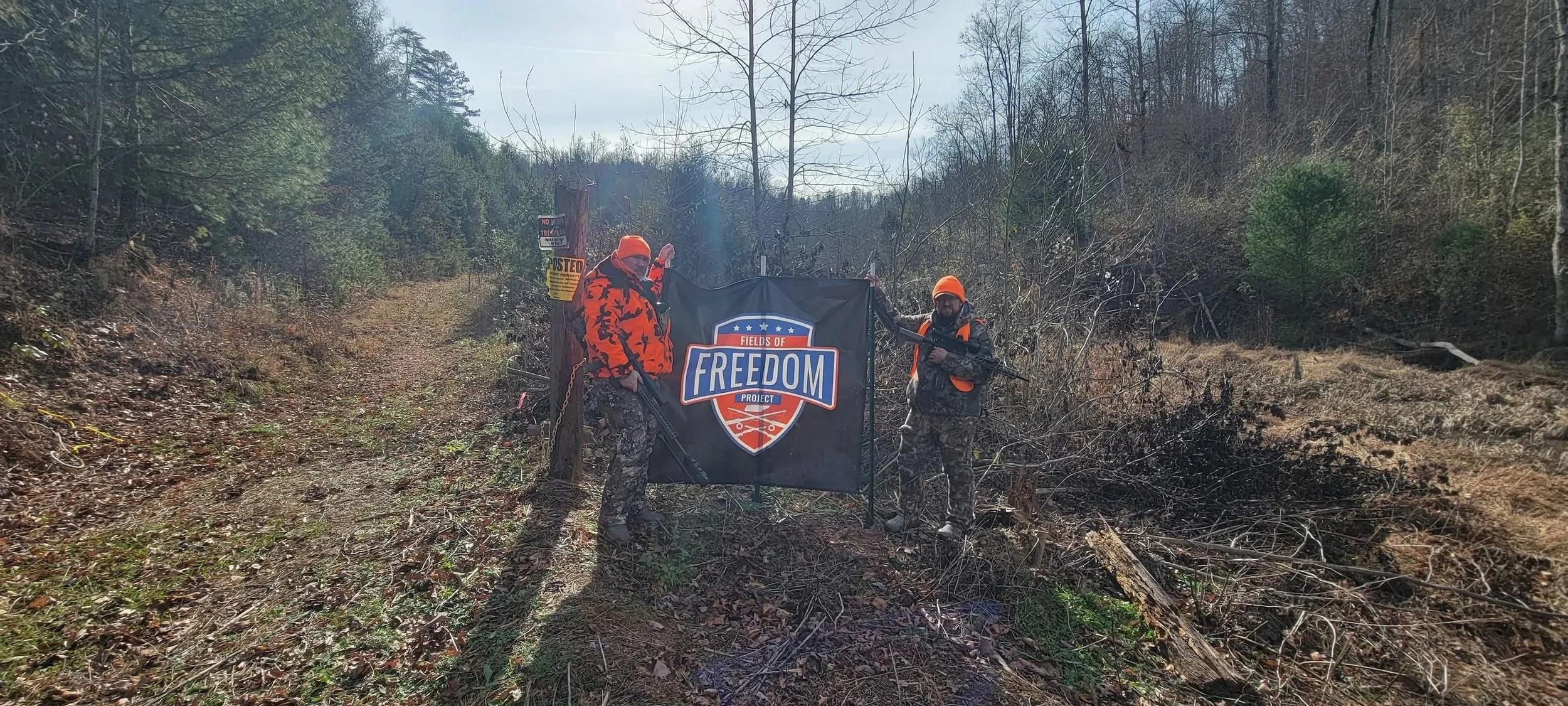 Two guys at sign.jpg