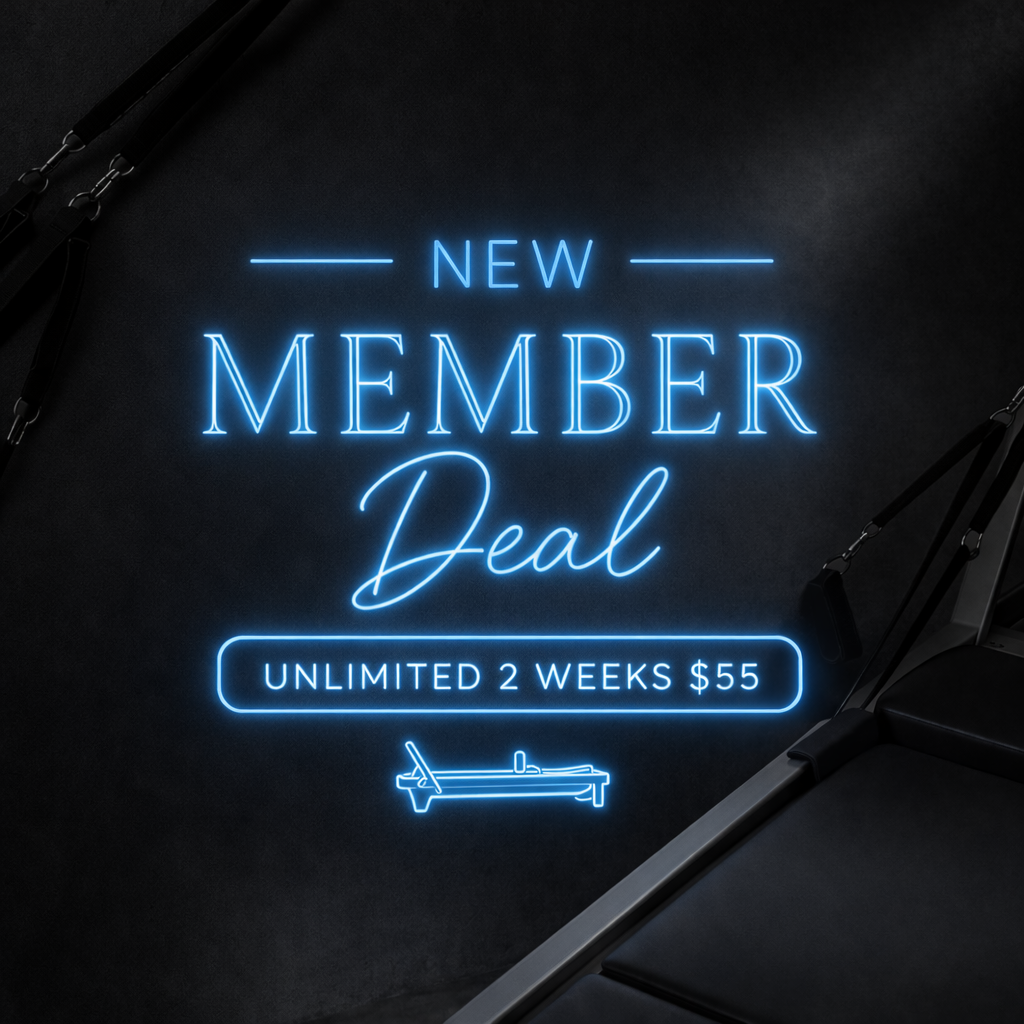 Bright blue neon sign on a black wall advertising a new membership deal for unlimited two weeks for $55, with a drawing of a massage table below.