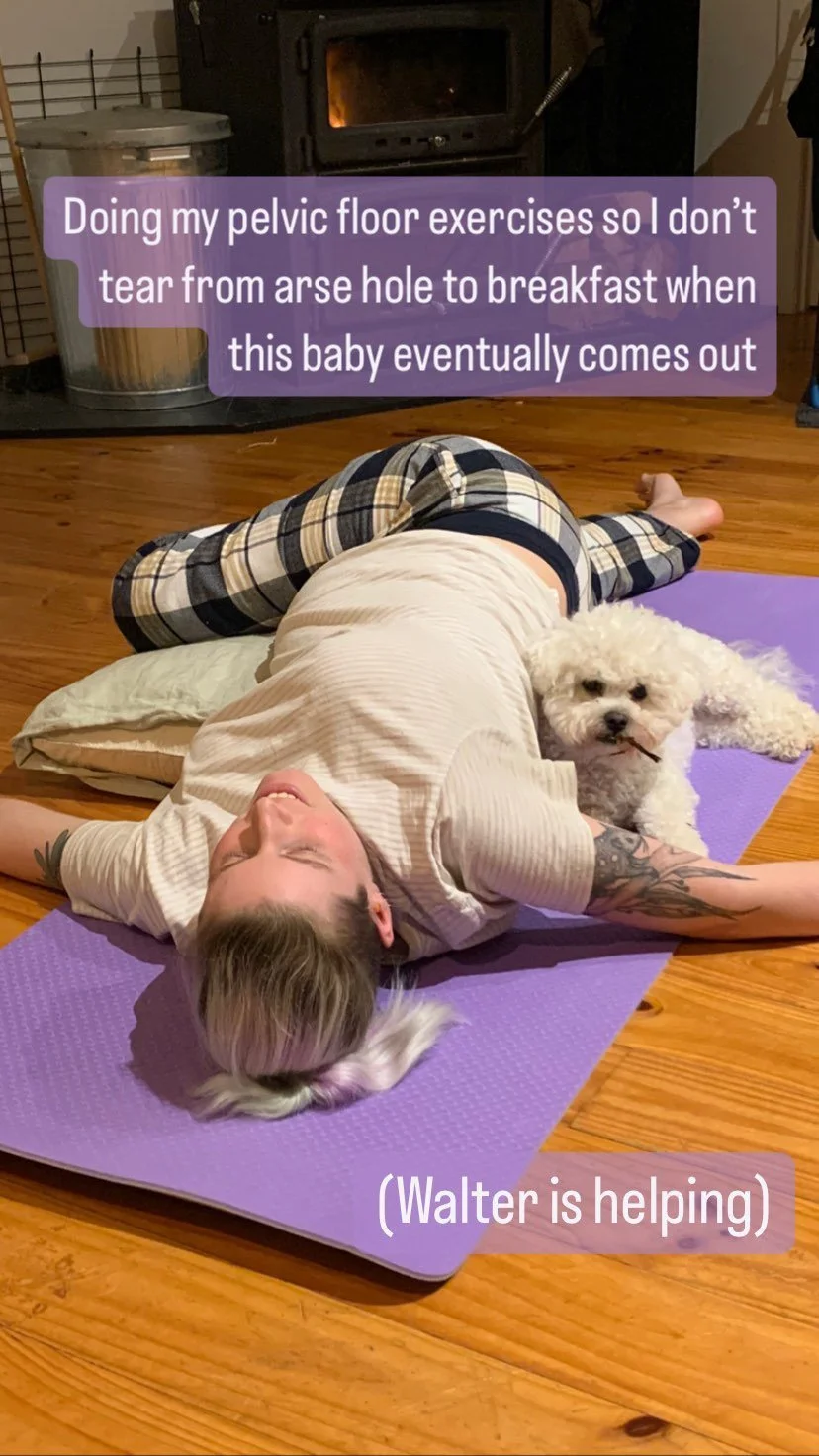 a pregnant person and a dog doing pelvic floor exercises on a yoga mat