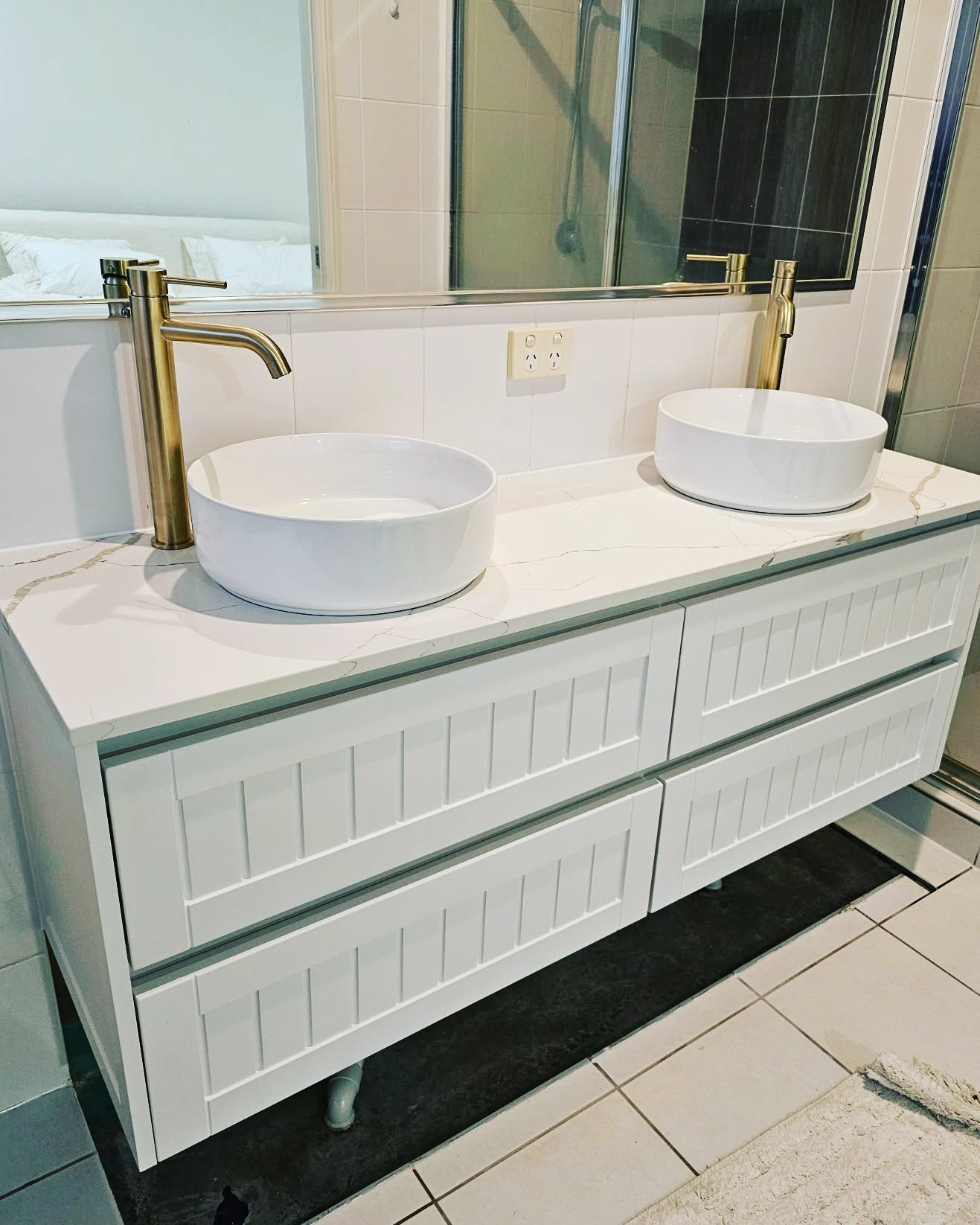 A vanity upgrade completed by us ✨️ this job started out as a water leak that had damaged the original vanity. We found the water leak and fixed it, then replaced the vanity with this wall hung and completed with a stone top and brushed brass fixture