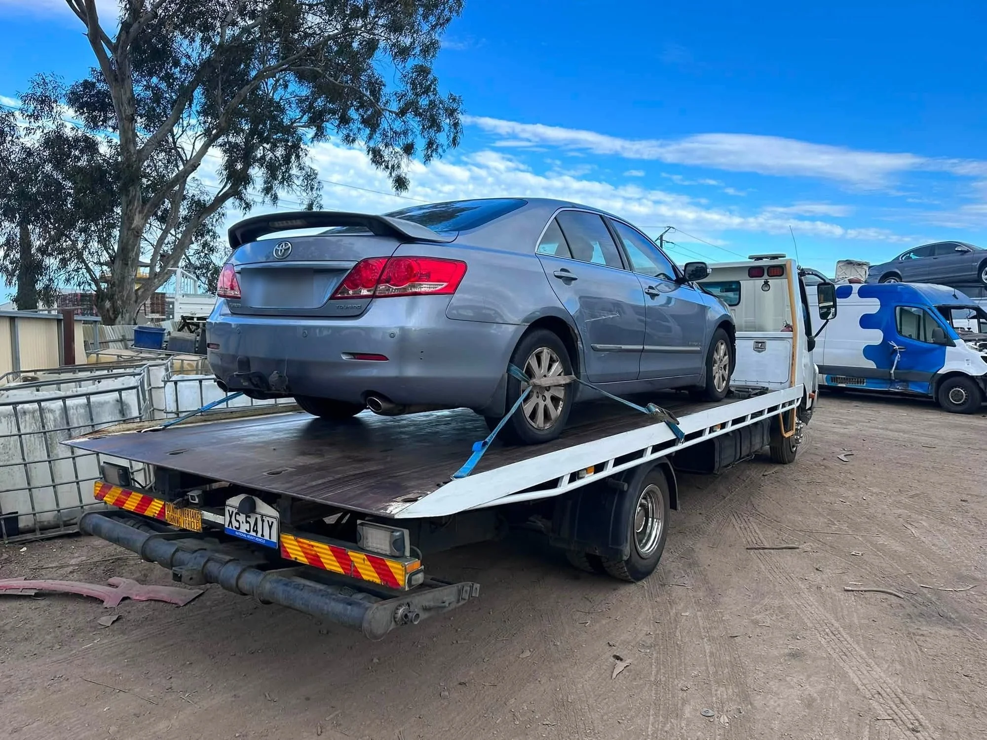 Cash for Cars Adelaide tilt tray picking up a silver Toyota sedan in Adelaide