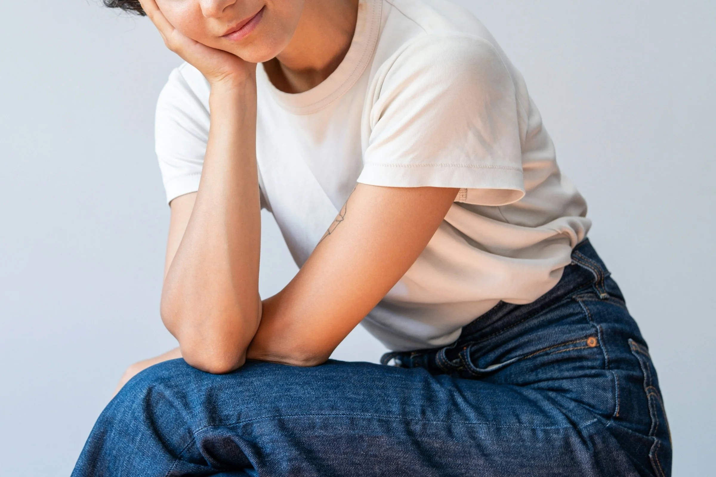 a closeup of a person wearing a white tshirt