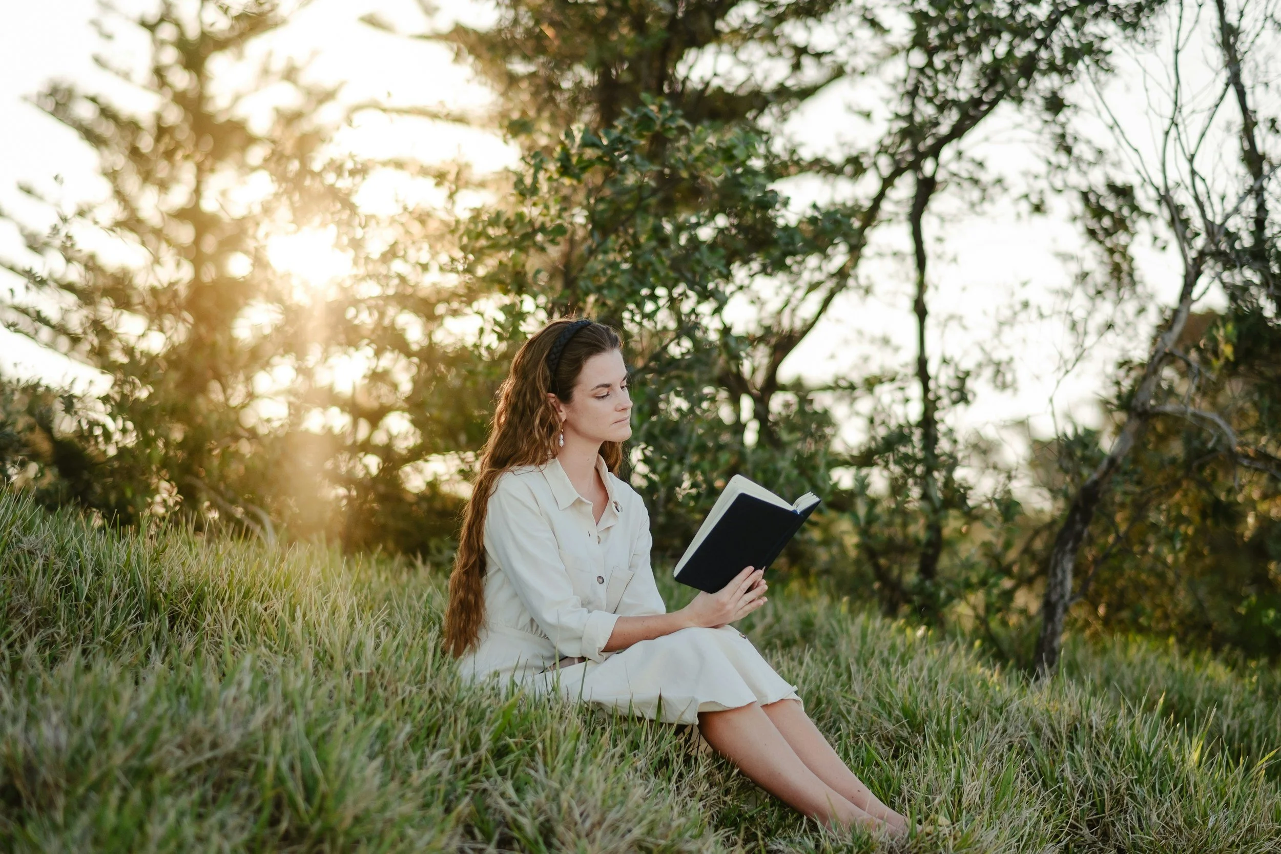 Woman reading in a field