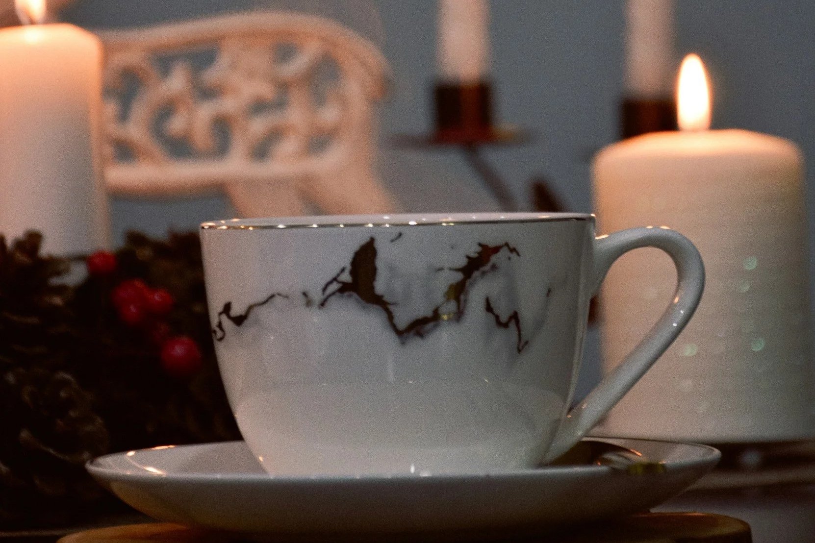 china cup and Christmas candle