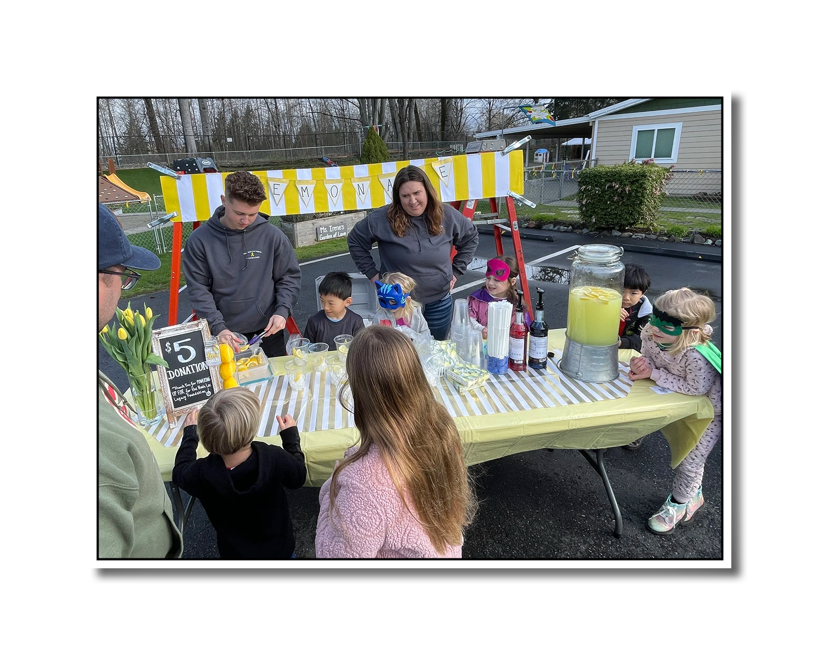 Photo depicts a community lemonade stand raising donations for the NLLF.