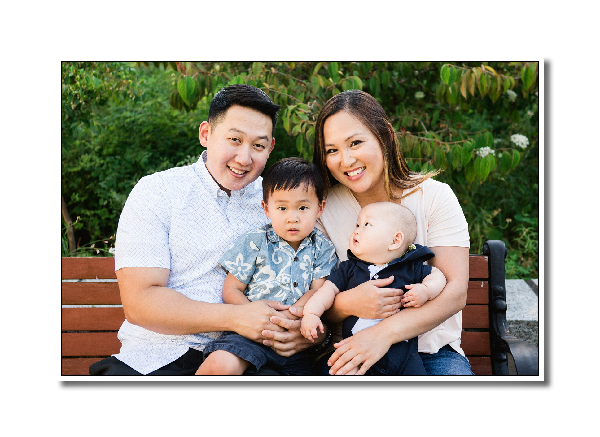 A professional portrait of the Lee family - Enoch, Grace, Kyle, and Noah- when Noah was a baby.