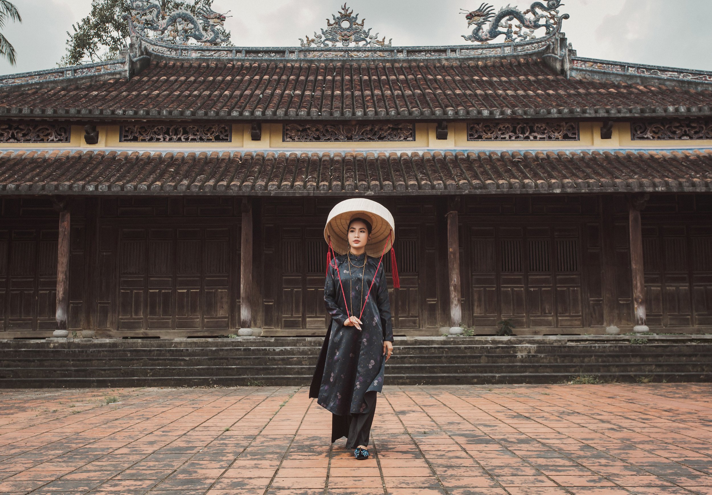 vietnamese woman outside temple.jpg