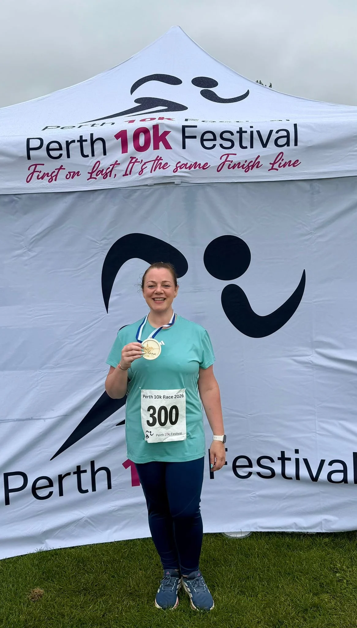 Jennifer with her medal after completing the Perth 10k