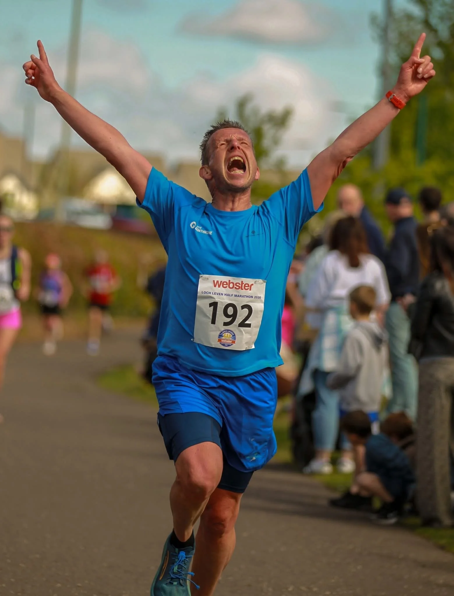 Steve with a look of sheer joy as he crosses the finish line of the Loch Leven Half Marathon