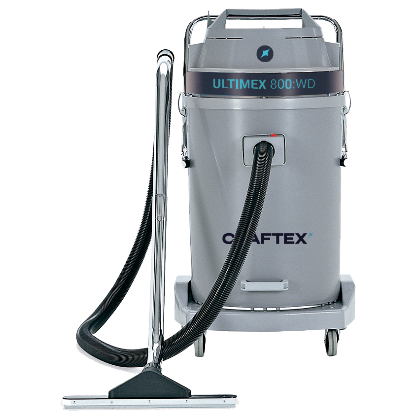 Industrial vacuum cleaner with a gray body, labeled 'ULTIMEX 800:WD', equipped with a handle, wheels, and a large hose.