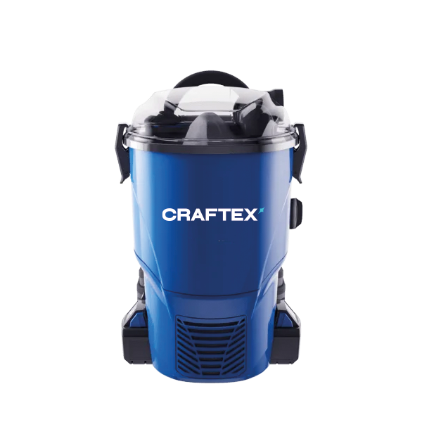 A blue Craftex wet/dry shop vacuum with a clear plastic lid and a black handle, positioned against a black background.