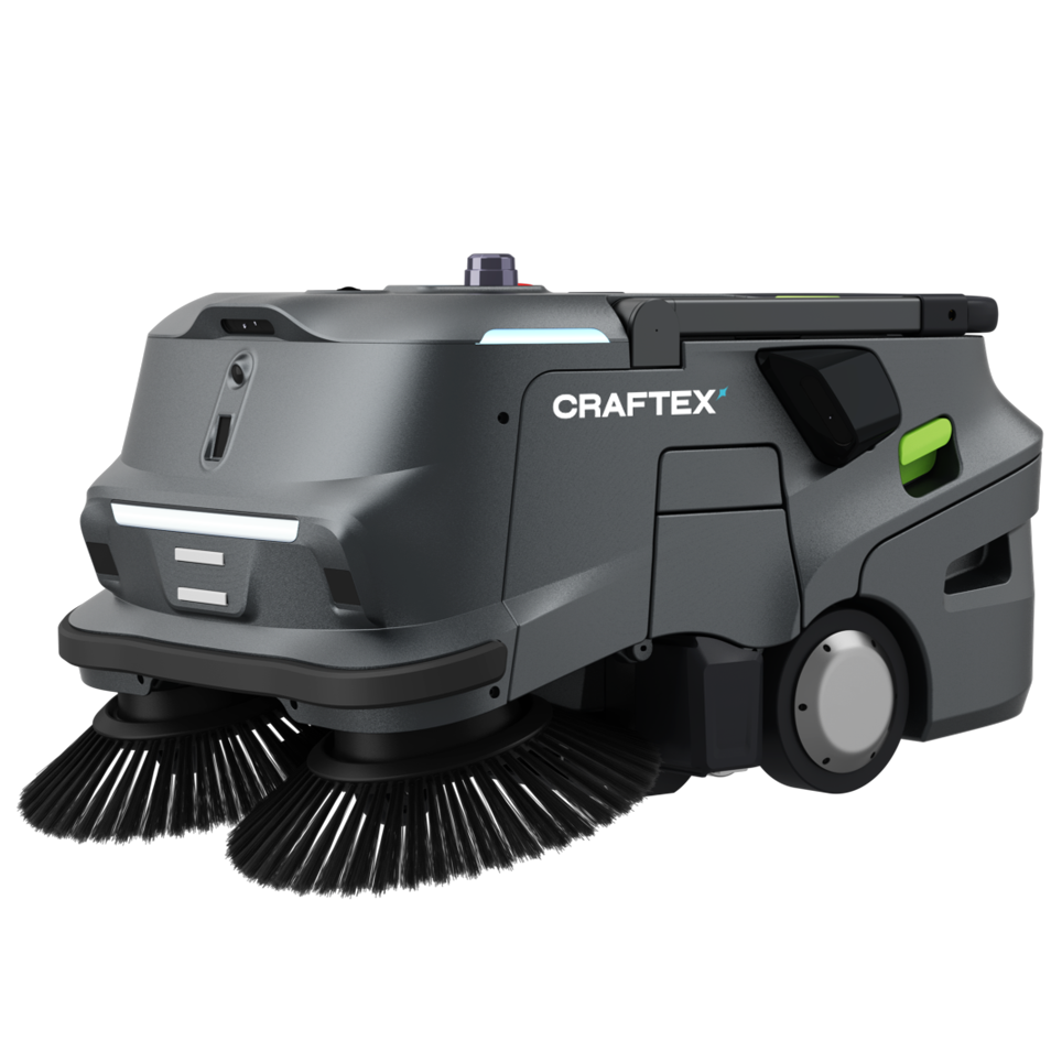 A Craftex industrial floor cleaning robot with brushes, black and gray body, green and black components, and the company's logo on the side.